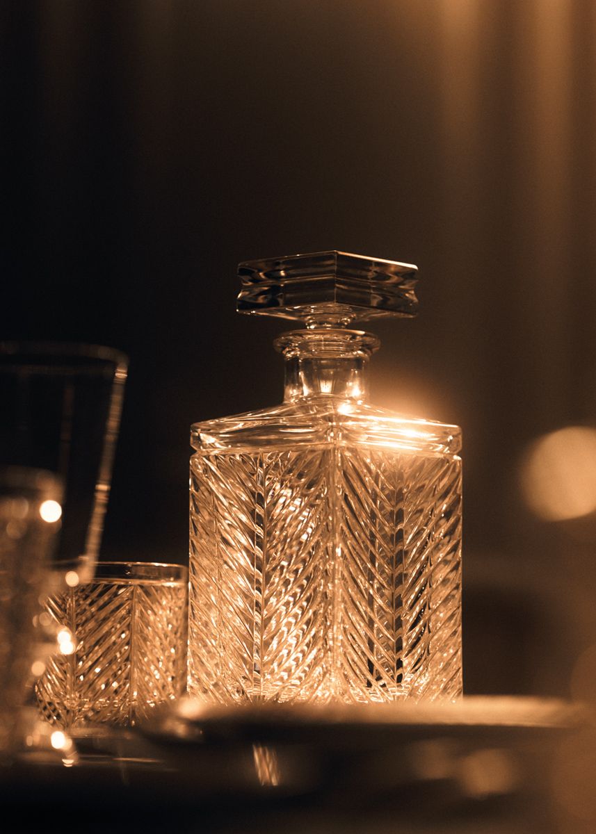 The Le Noël de Monsieur whiskey decanter is engraved with a chevron motif that catches the light