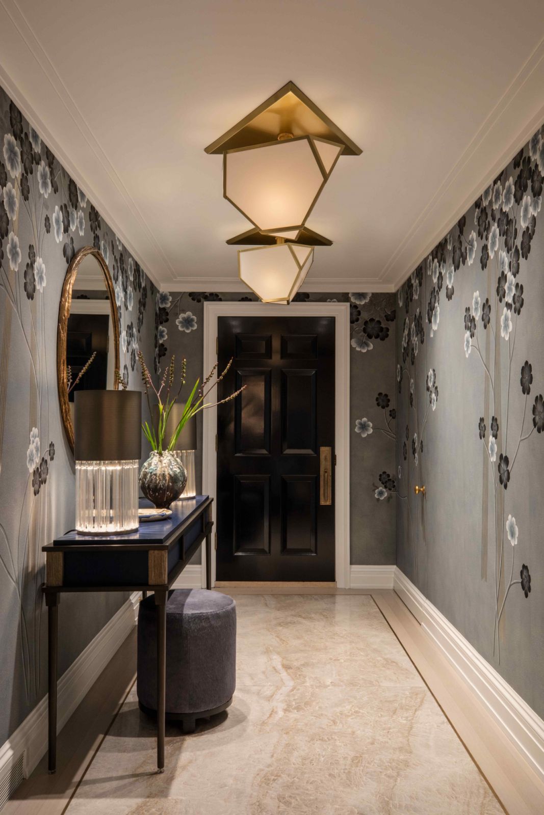 Hand-painted de Gournay wallpaper lines the front foyer walls