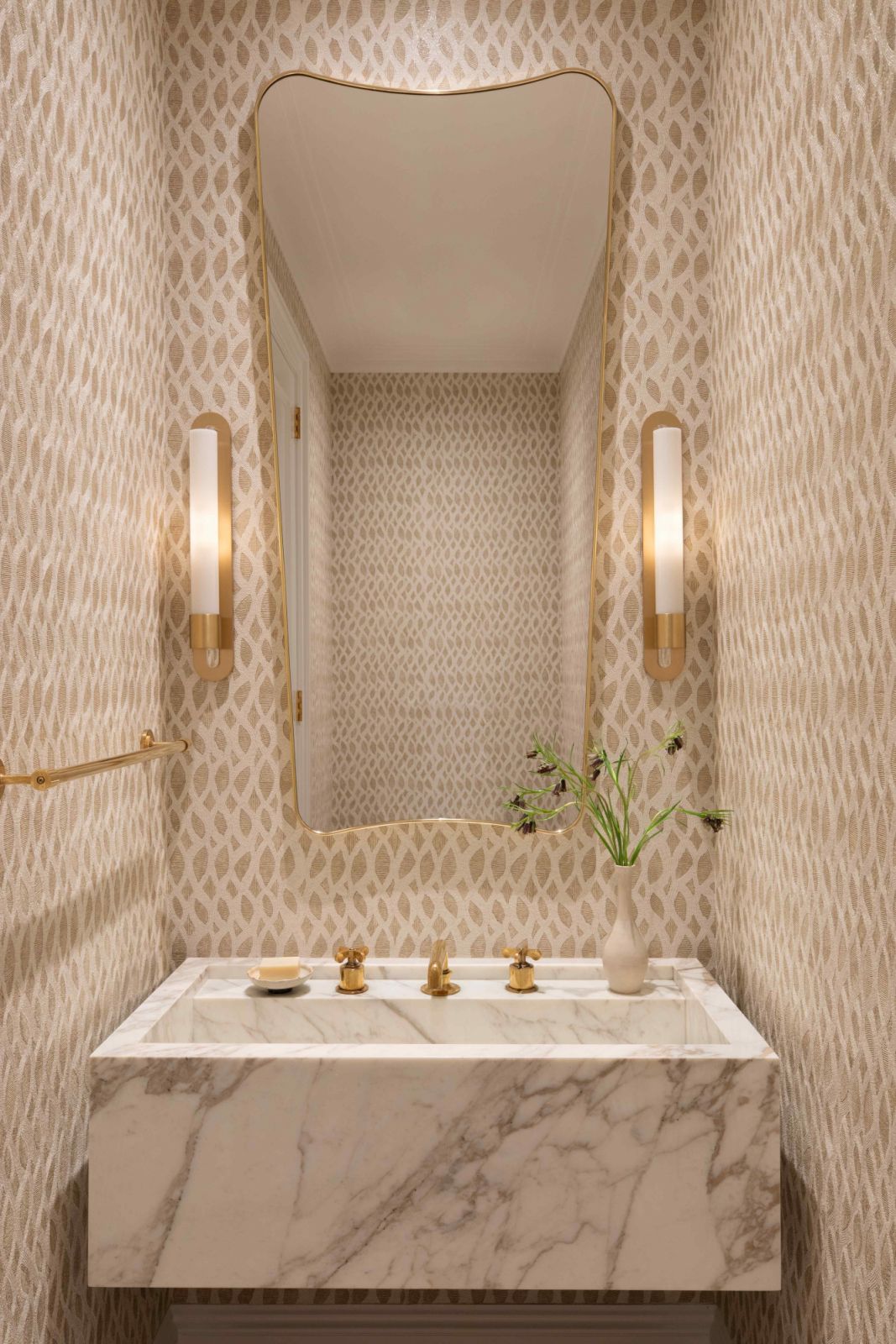 Patterned wallpaper and marble stone bring depth