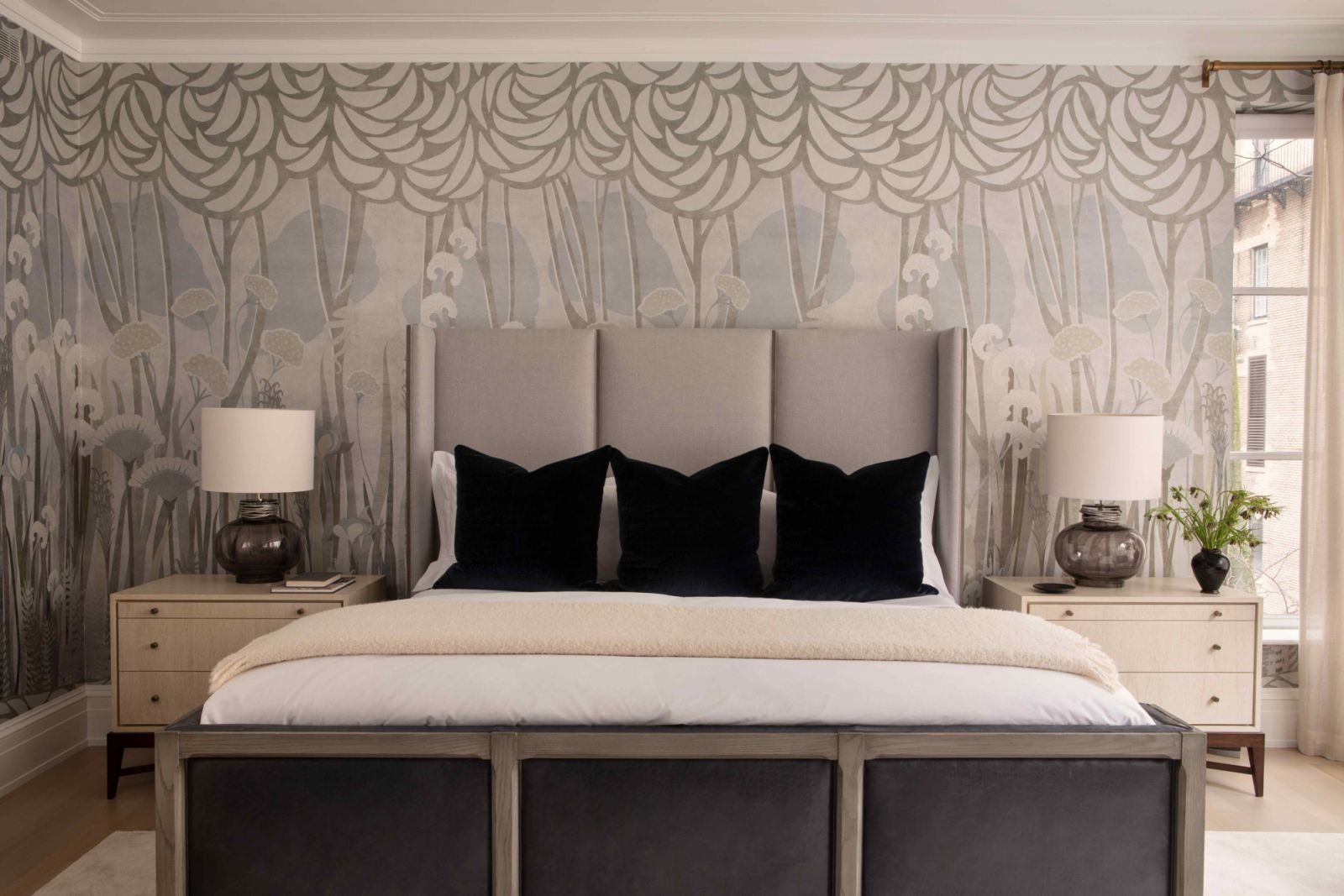 The minimalist palette extends into the primary bedroom