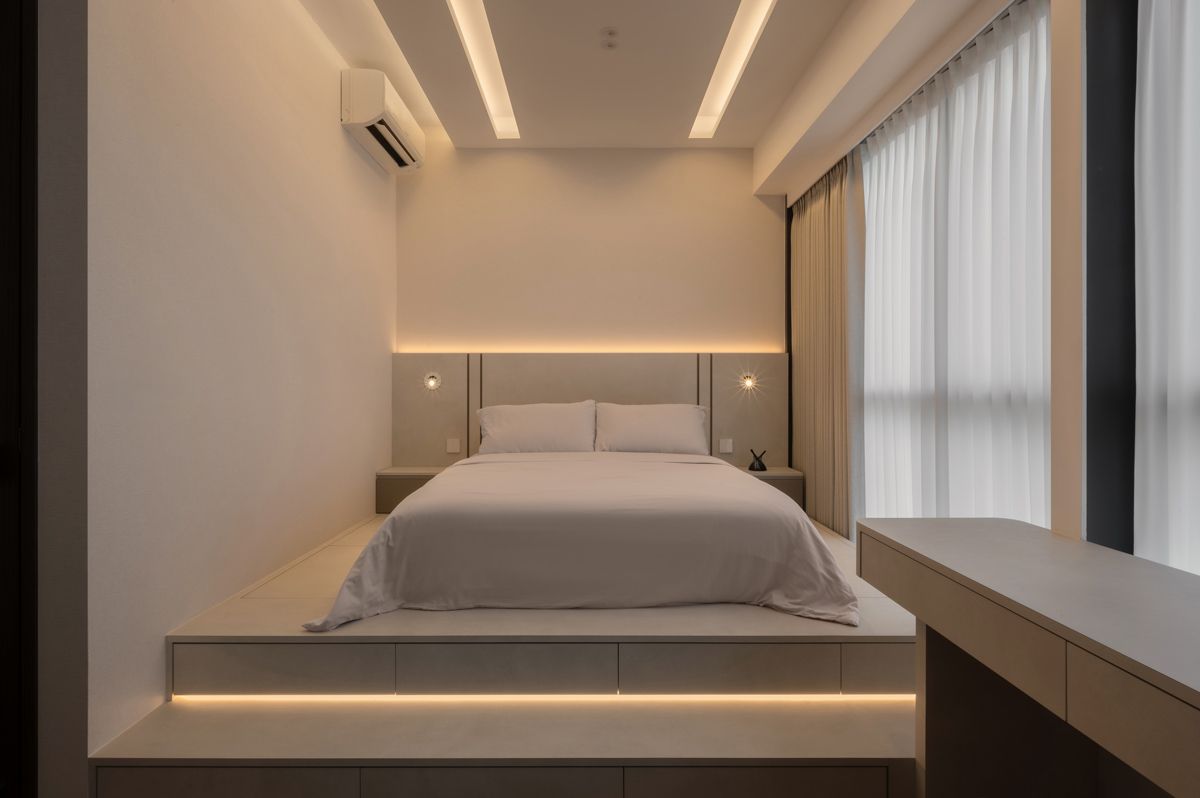 The bed is situated on an elevated storage platform