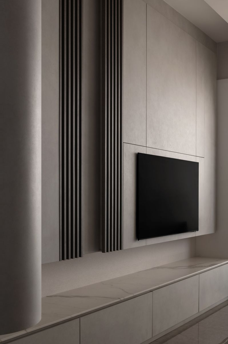 The storage compartment below the TV wall is dedicate to the owners' Maltese
