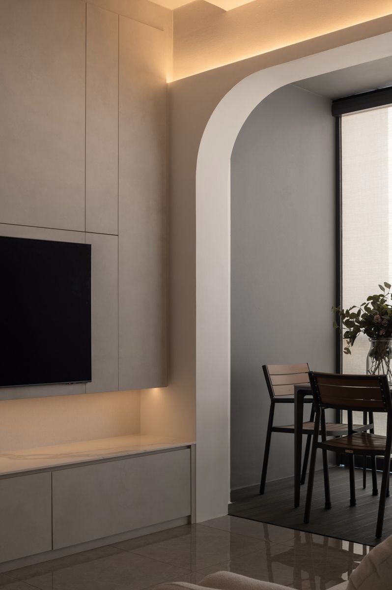 Twothree Design uses gently curved archway demarcates the living and dining spaces