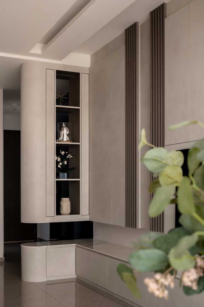 The curved edge of the display shelves lends an organic touch to the room