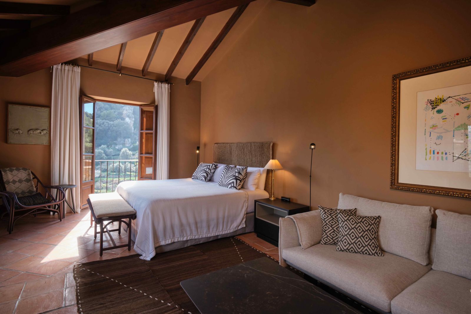 Suites and terrace rooms with wood-beamed ceilings and French doors that open out to the boundless scenery (Photo: Hotel Valldemossa)