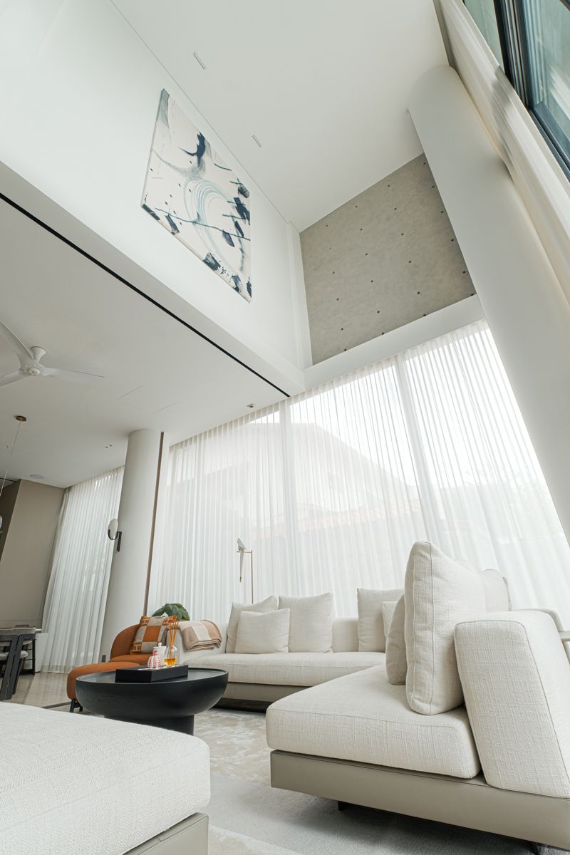 The double height living room is punctuated by artwork