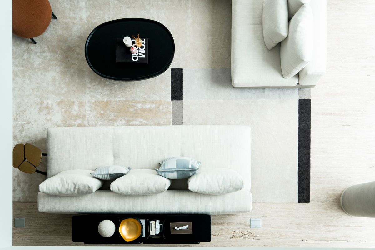 The carefully curated minimalist living room as seen from the spiral staircase
