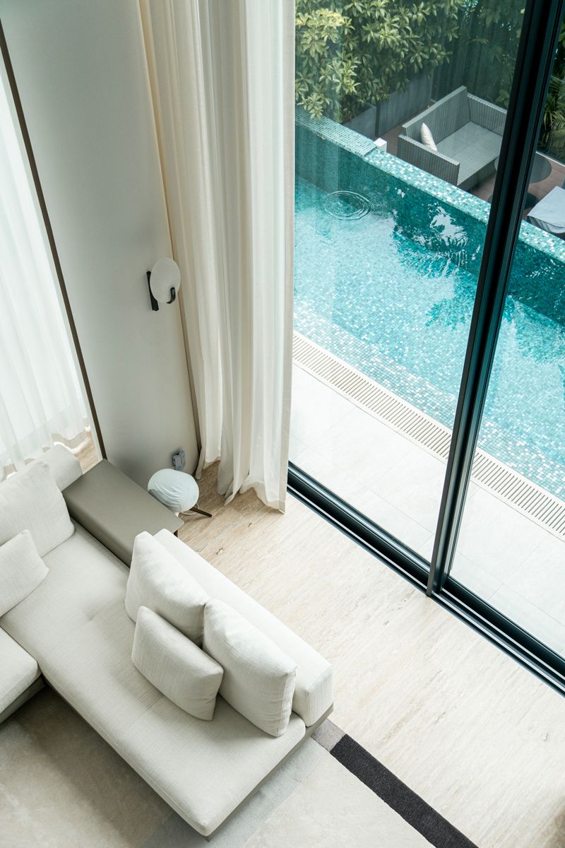 A lap pool outside has direct access to the living area