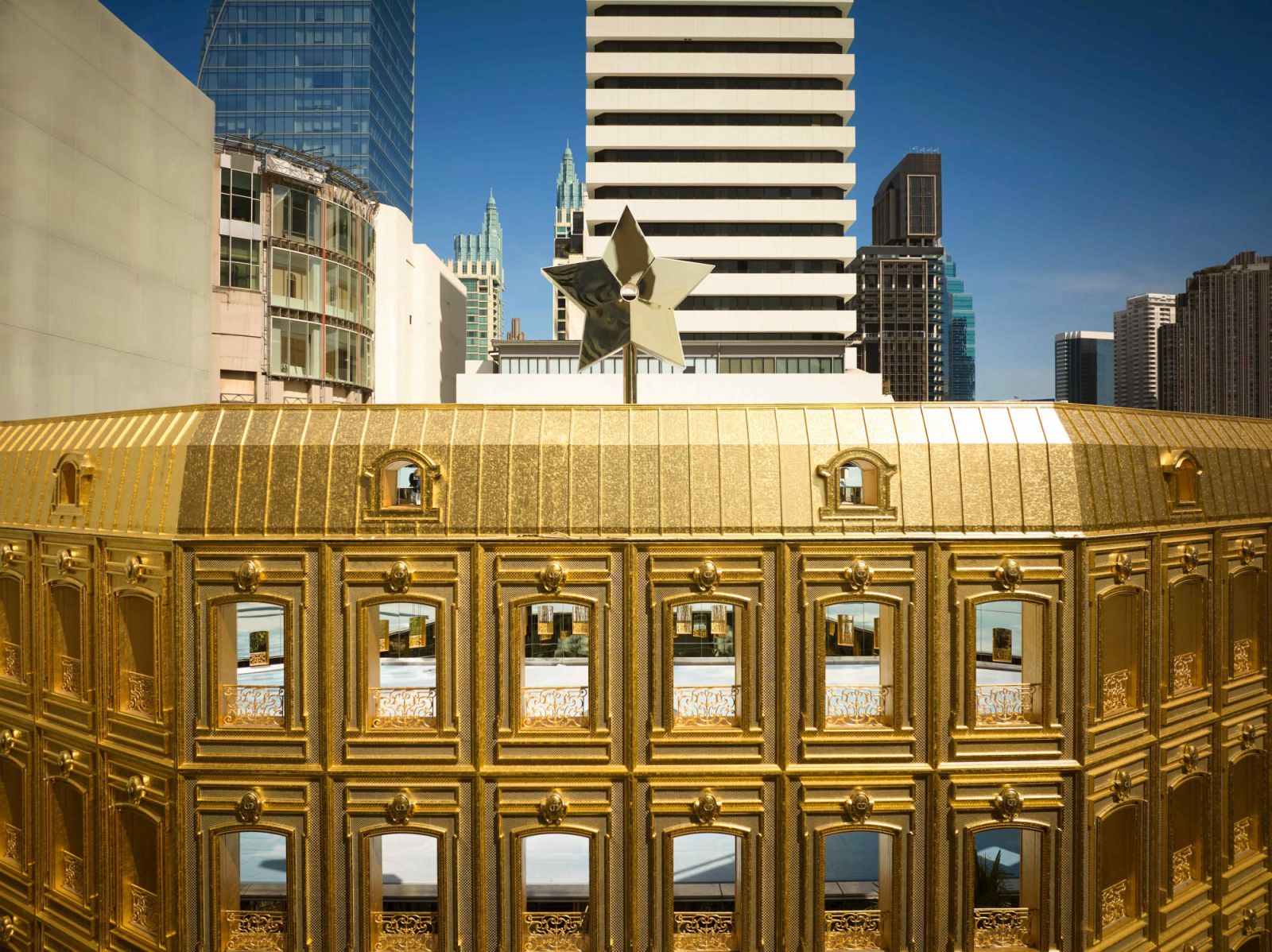 The entire structure is adorned in gold, Dior’s eternal design code