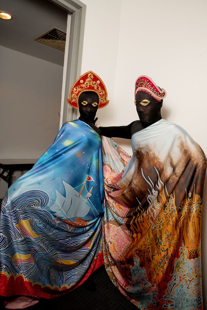 A model (right) wearing grand prize winner Nazri’s design