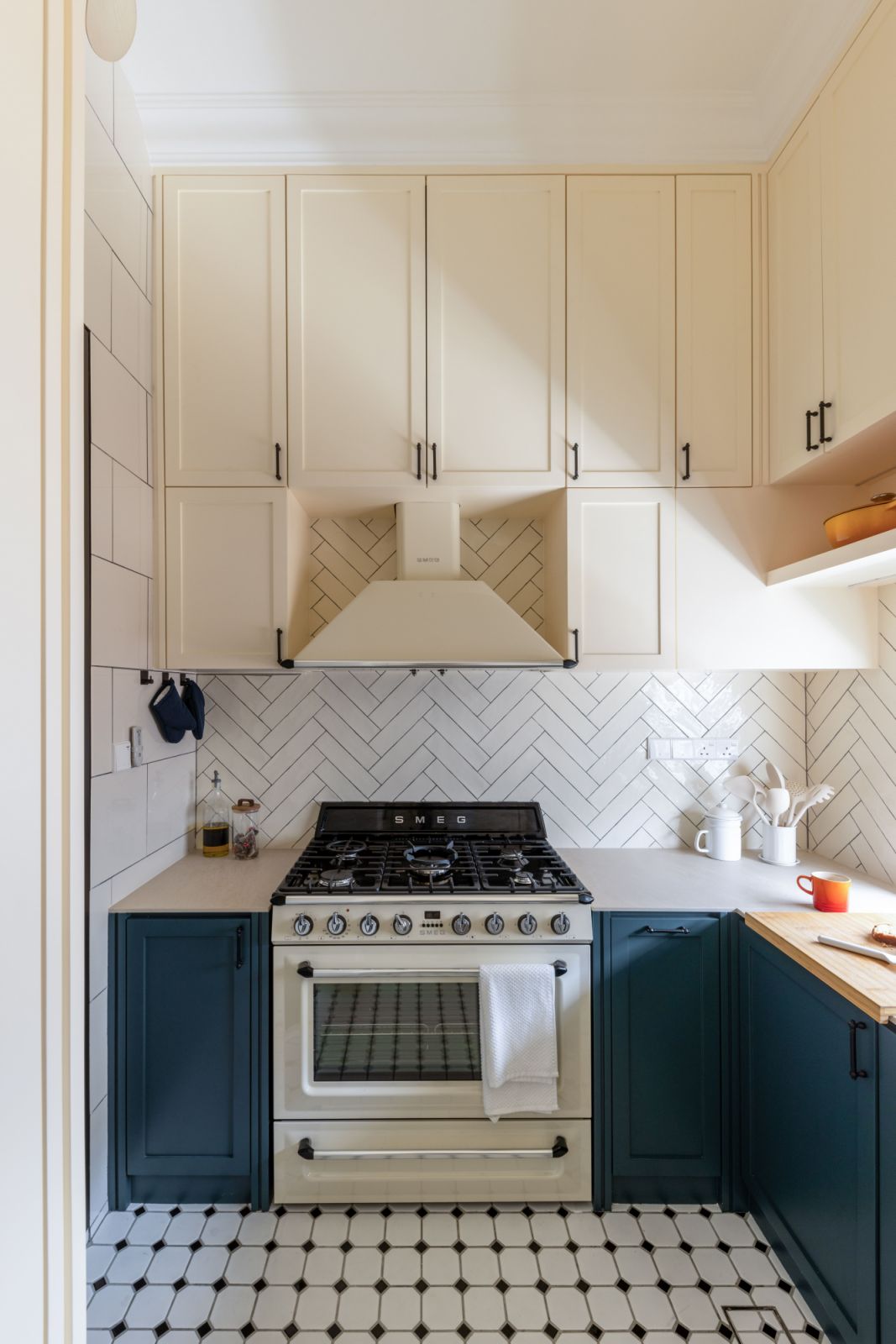 Forest green cabinetry and Dekton countertops blend luxury with functionality in the open-plan dry kitchen