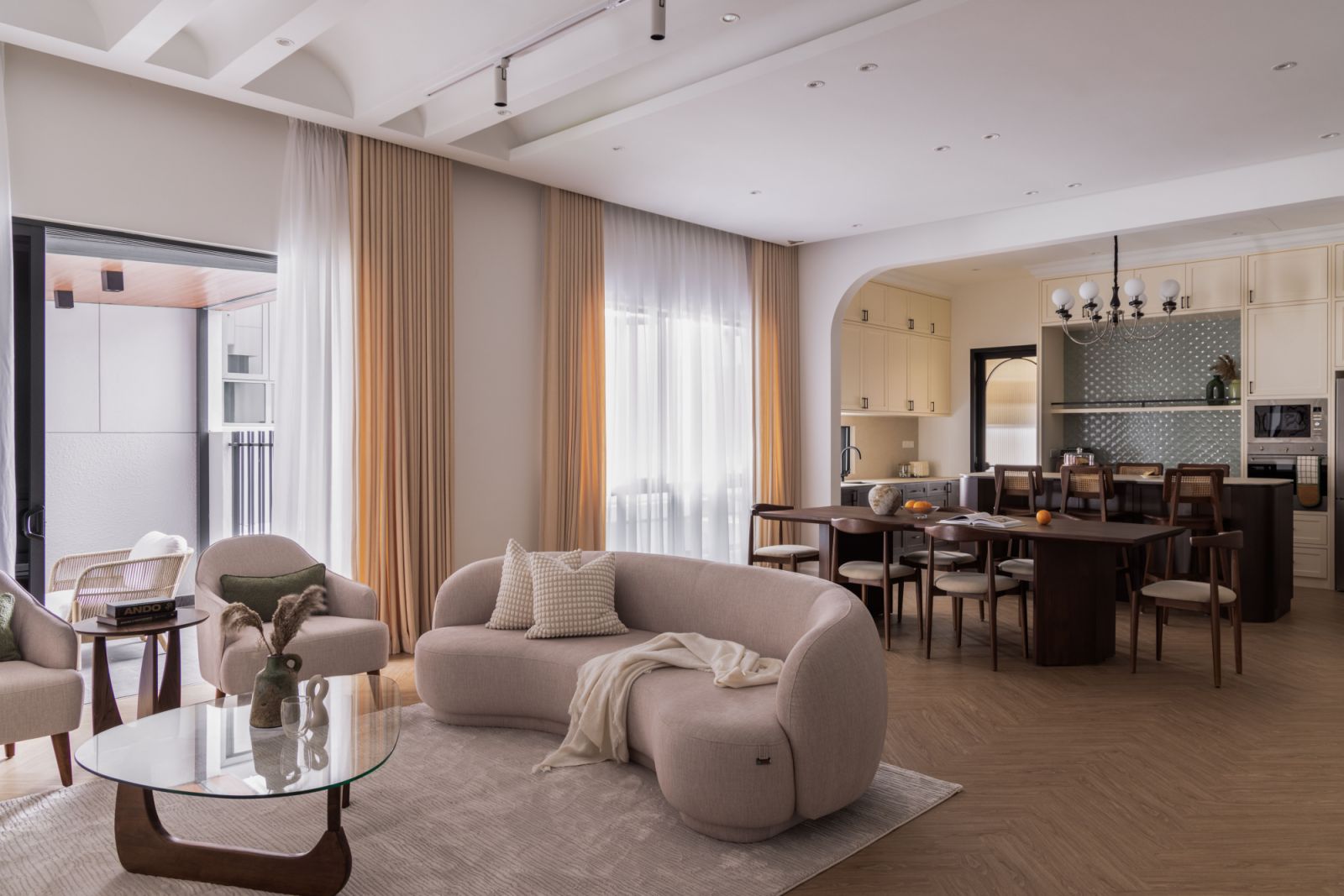 The living room's custom curved ceiling sets the tone for the home’s modern aesthetic.