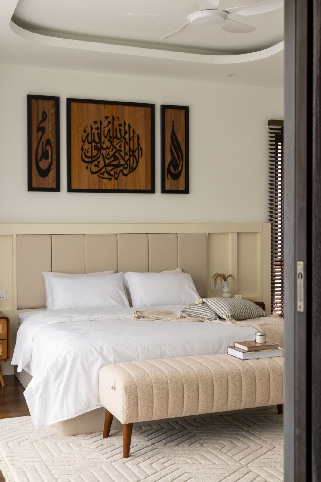 Soft neutrals and plush fabrics create a serene sanctuary in the master bedroom