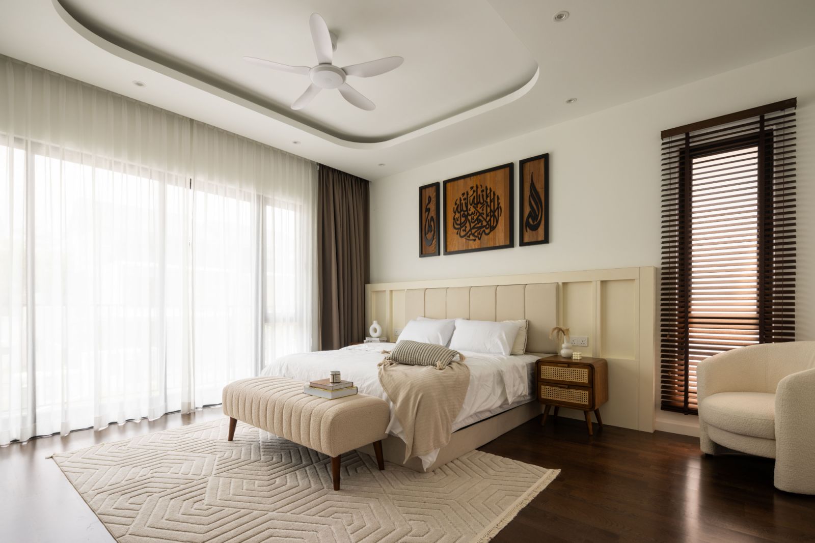 Soft neutrals and plush fabrics create a serene sanctuary in the master bedroom