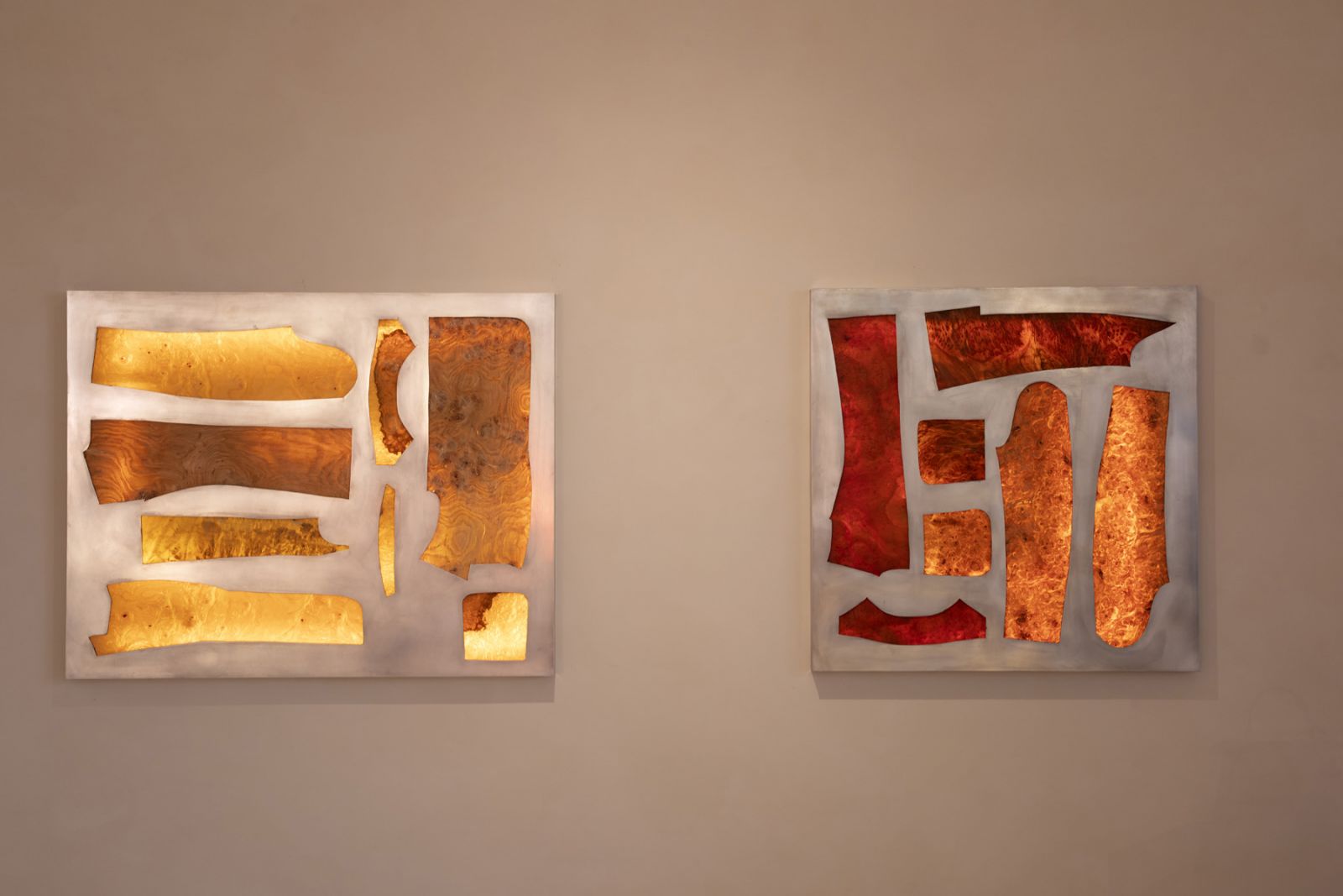 The Jacket Pattern wall panels showcase backlit burl wood through aluminium frames