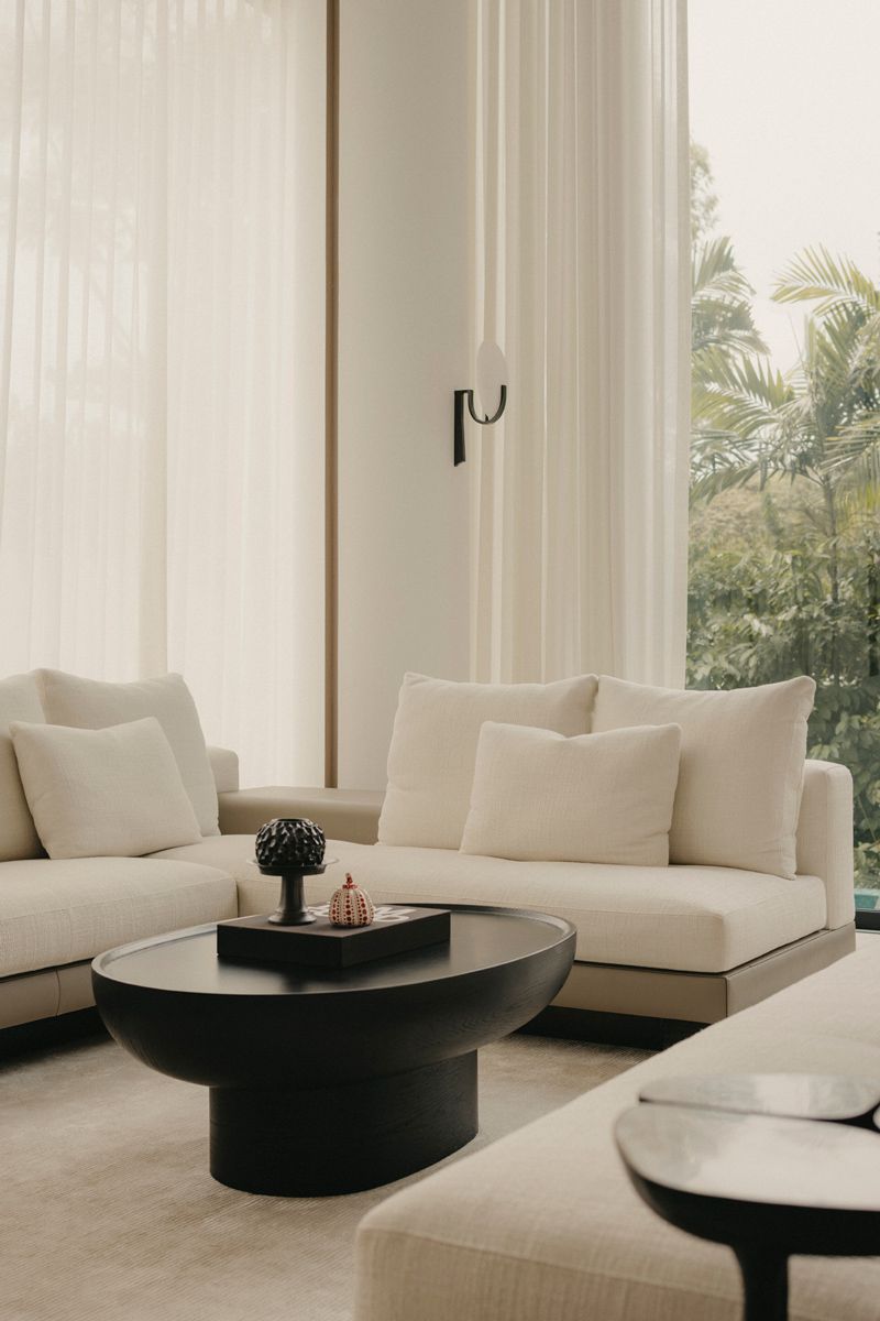 A neutral colour palette with black accent imbue the room with a timeless appeal
