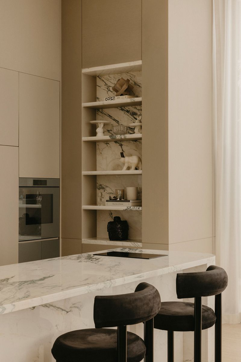 This shallow display nook finished in marble is both stylish and functional