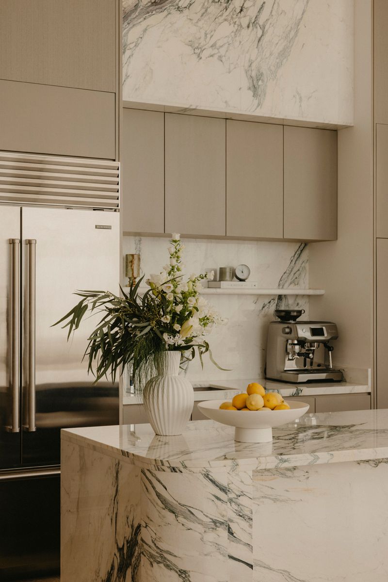 Solid grey, chrome and black-and-white surfaces make for an elegant material palette