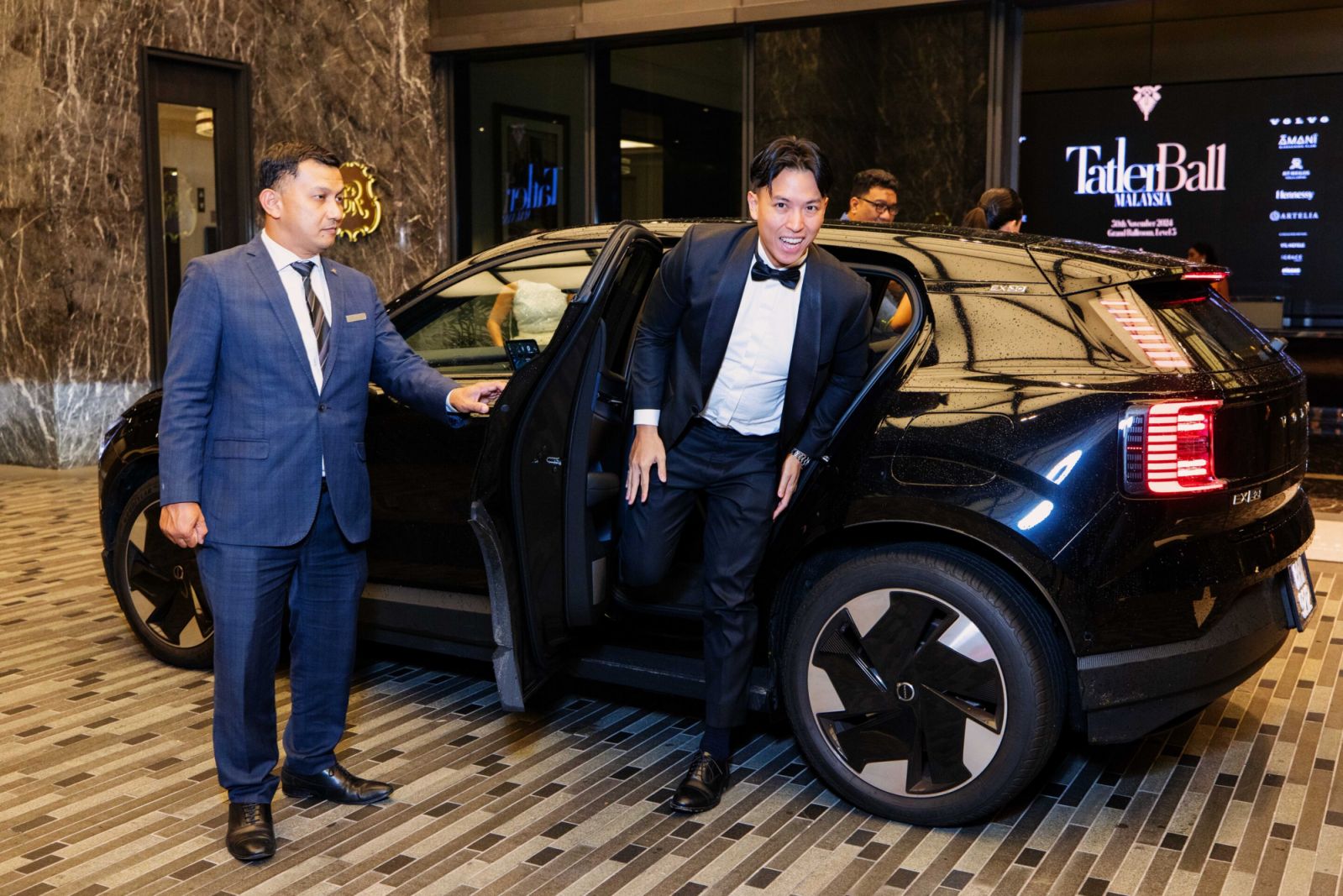 Zac Liew alights from a sleek Volvo EX30
