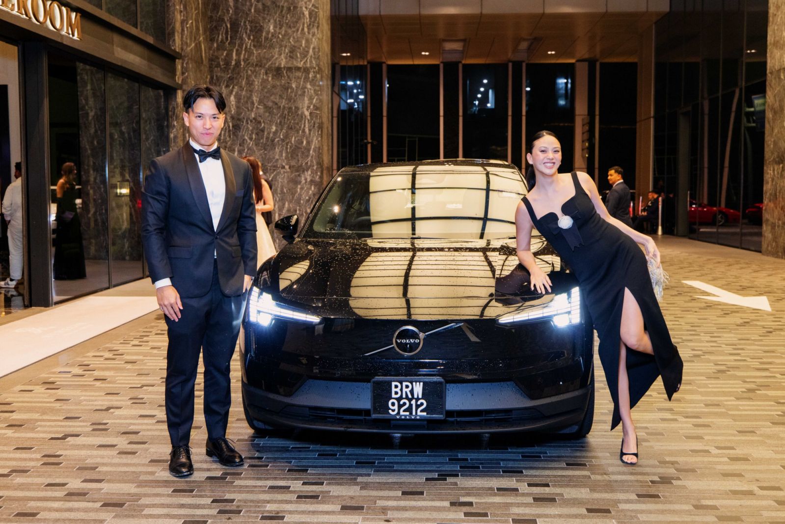 A moment of fun: Zac Liew and Katerina Lai arrive in a joyful mood in a Volvo EX30