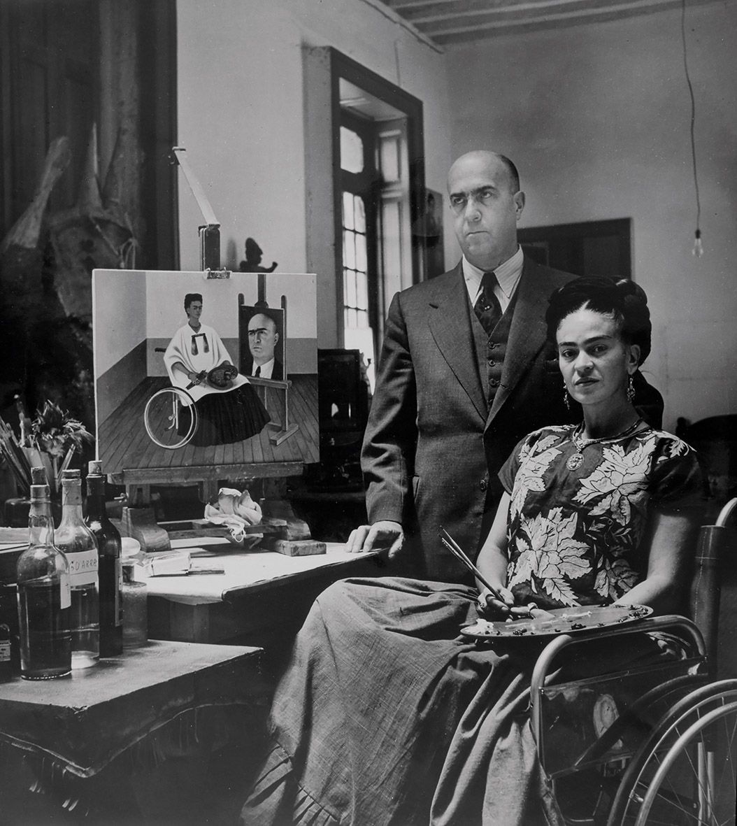 Kahlo and her surgeon Dr Juan Farill with her 1951 painting Self Portrait with the Portrait of Doctor Farill