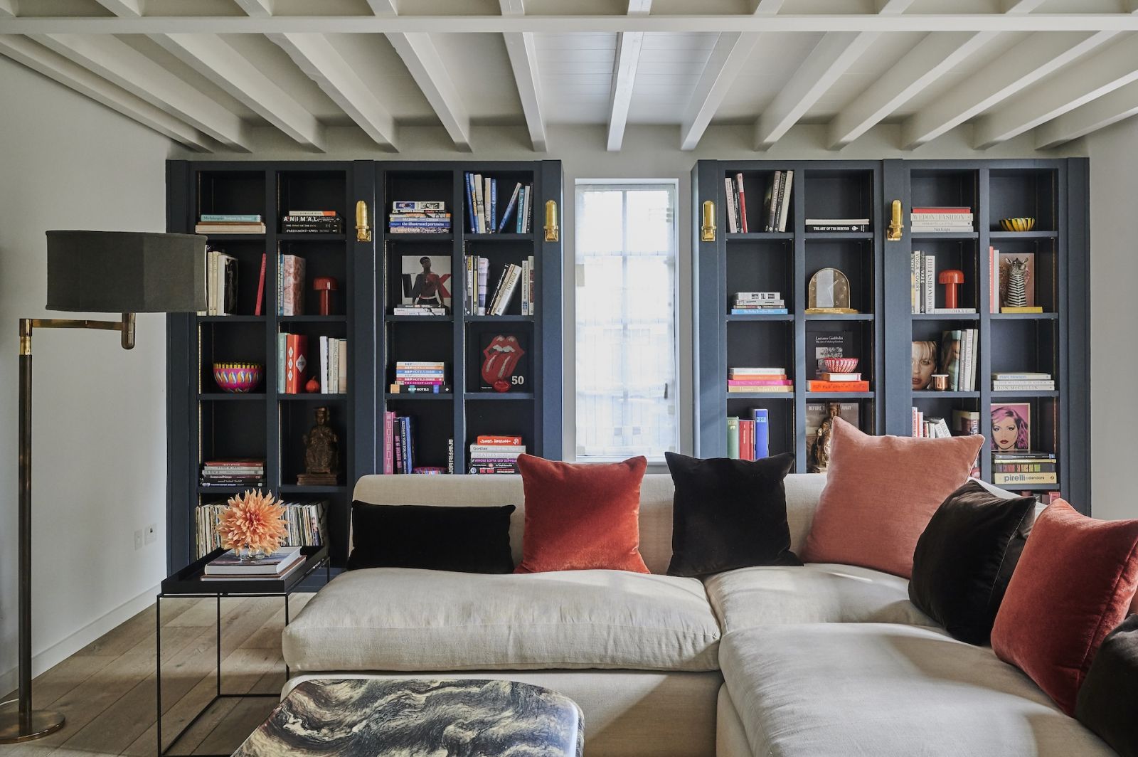 The library with floor-to-ceiling shelves that feature pops of colour