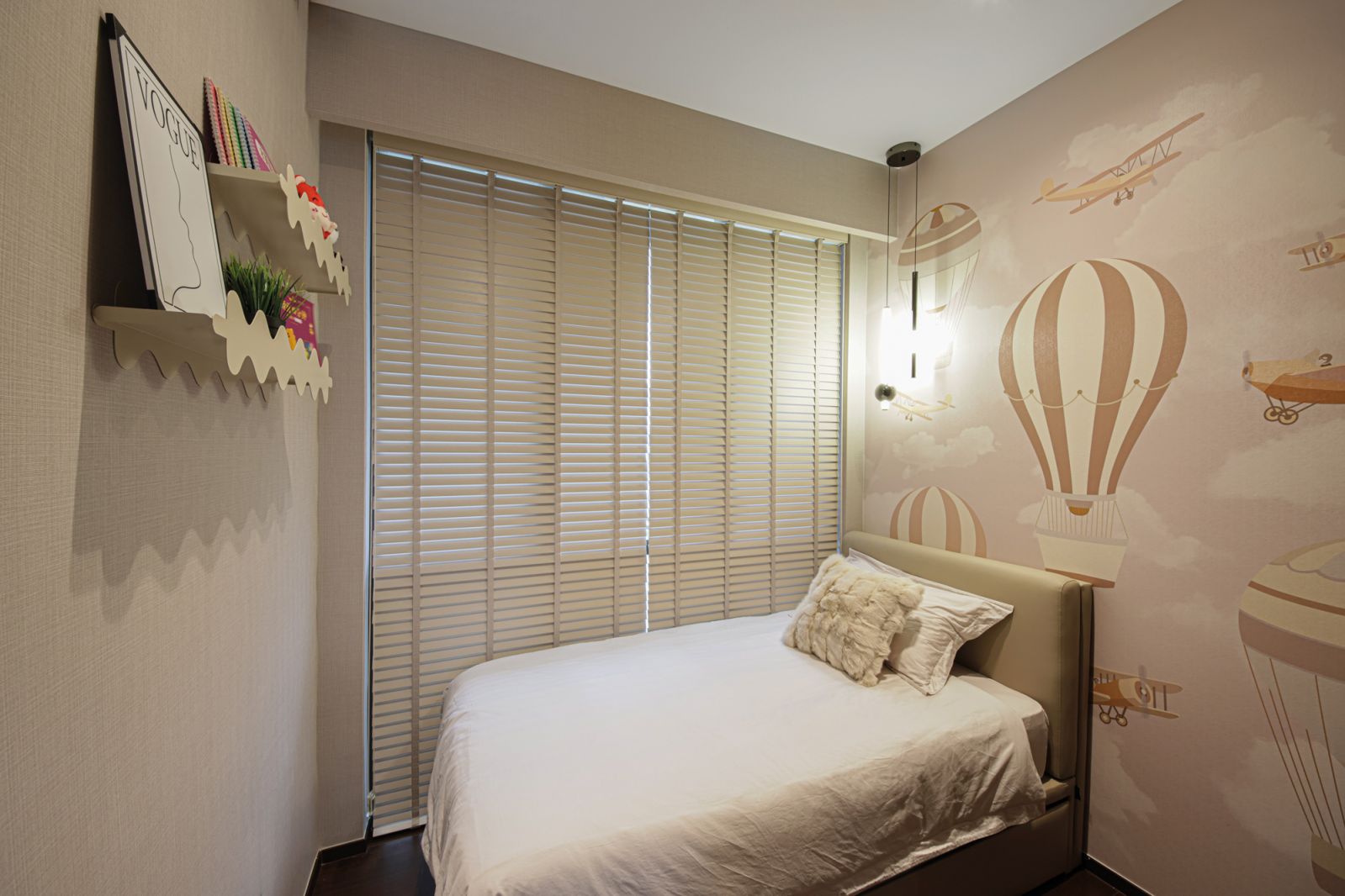 A charming wallpaper with an exploration theme imbues this child’s bedroom with a sense of whimsy