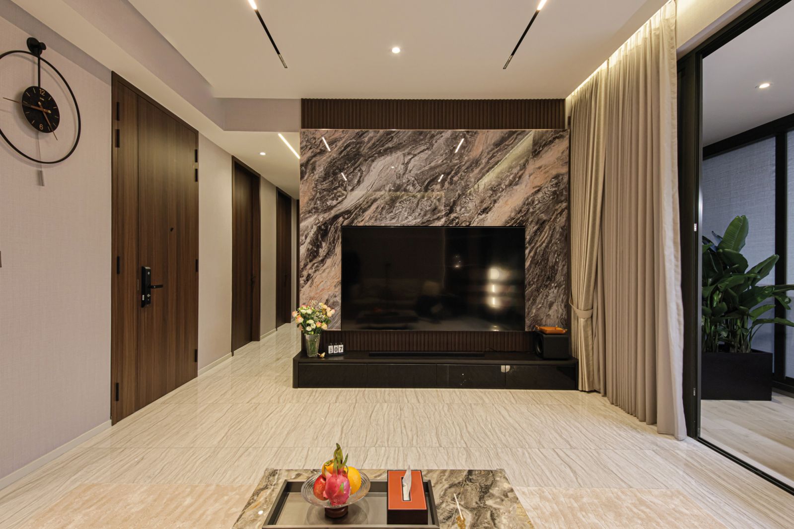 A marble feature wall makes an eye-catching statement against the placid overall palette