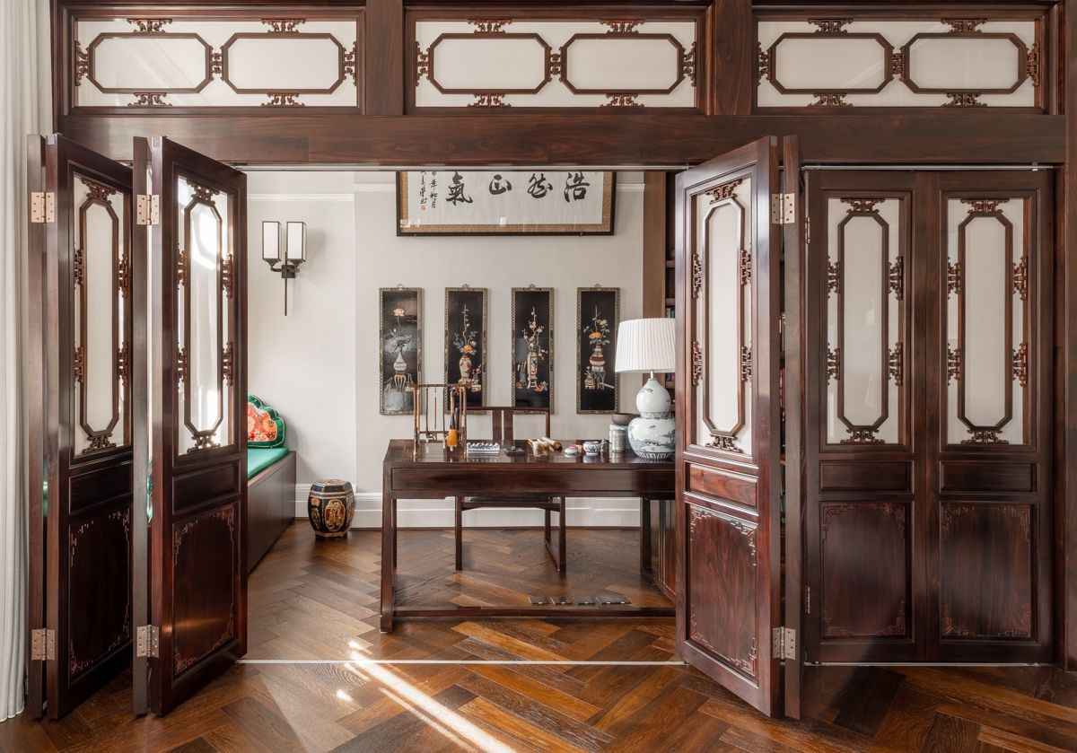 Traditional Chinese rosewood joinery bi-fold shutter screens in the study (Photo: Nicholas Worley)