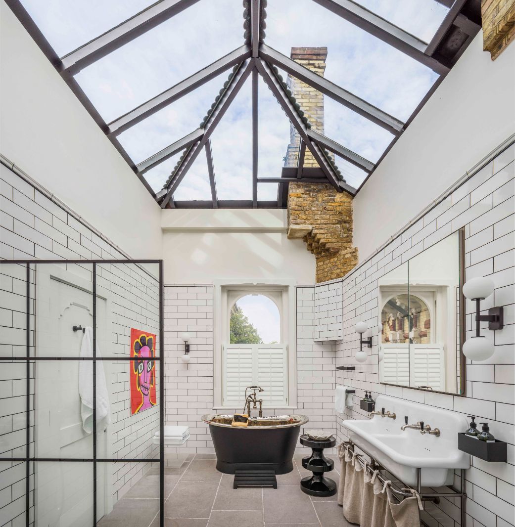 The light-filled bathroom with Victorian-style fixtures and a skylight (Photo: Mel Yates)