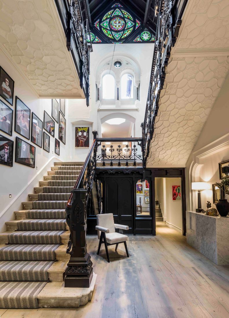 Wrought-iron staircase and stained-glass windows (Photo: Mel Yates)
