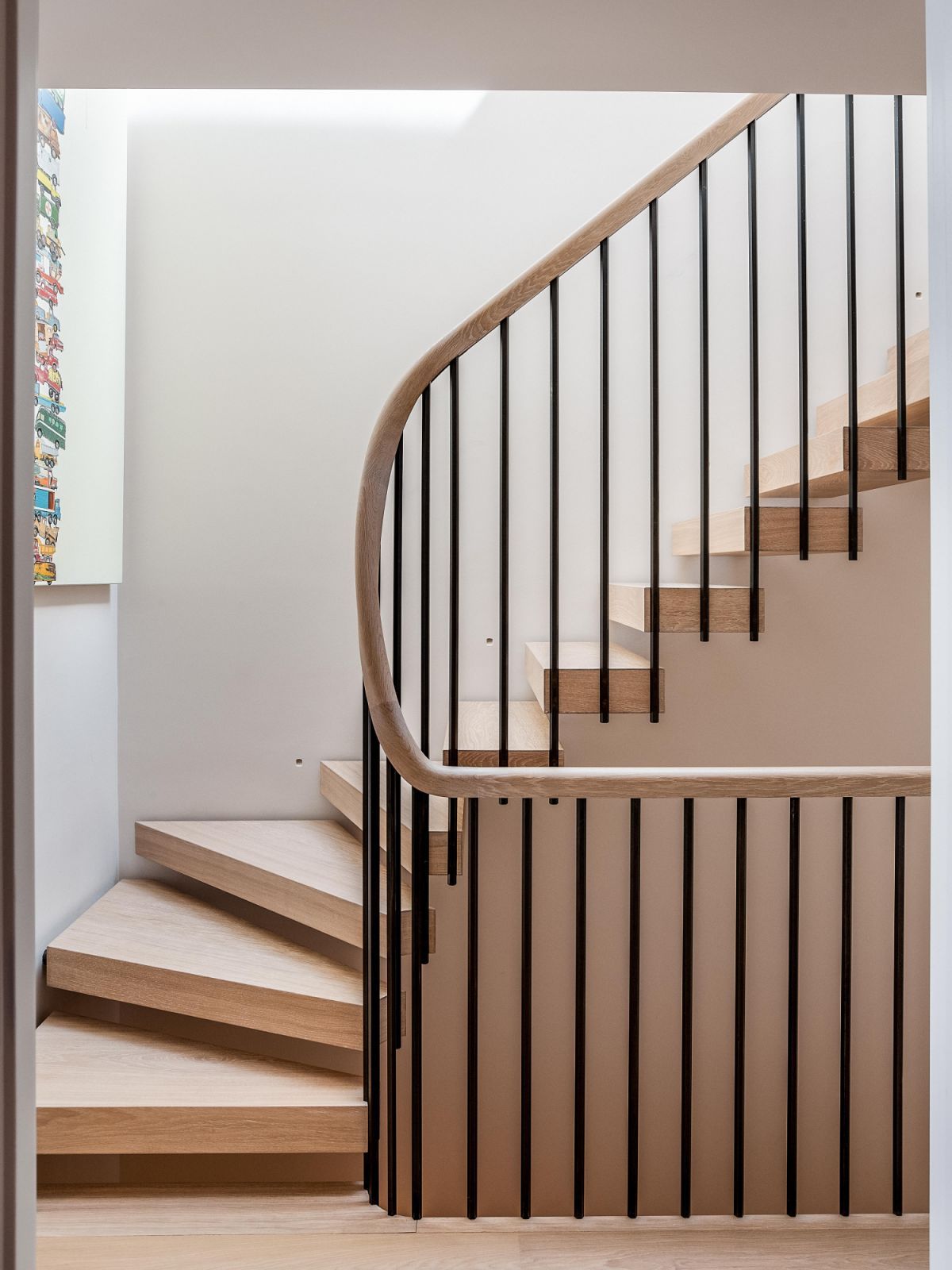The staircase features hexagonal balustrades in patinated steel (Photo: Taran Wilkhu)