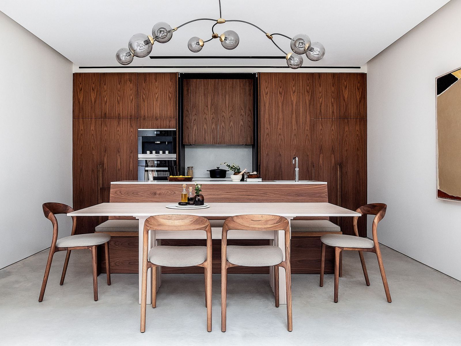 Walnut pocket doors that conceal utilities during entertaining (Photo: Taran Wilkhu)
