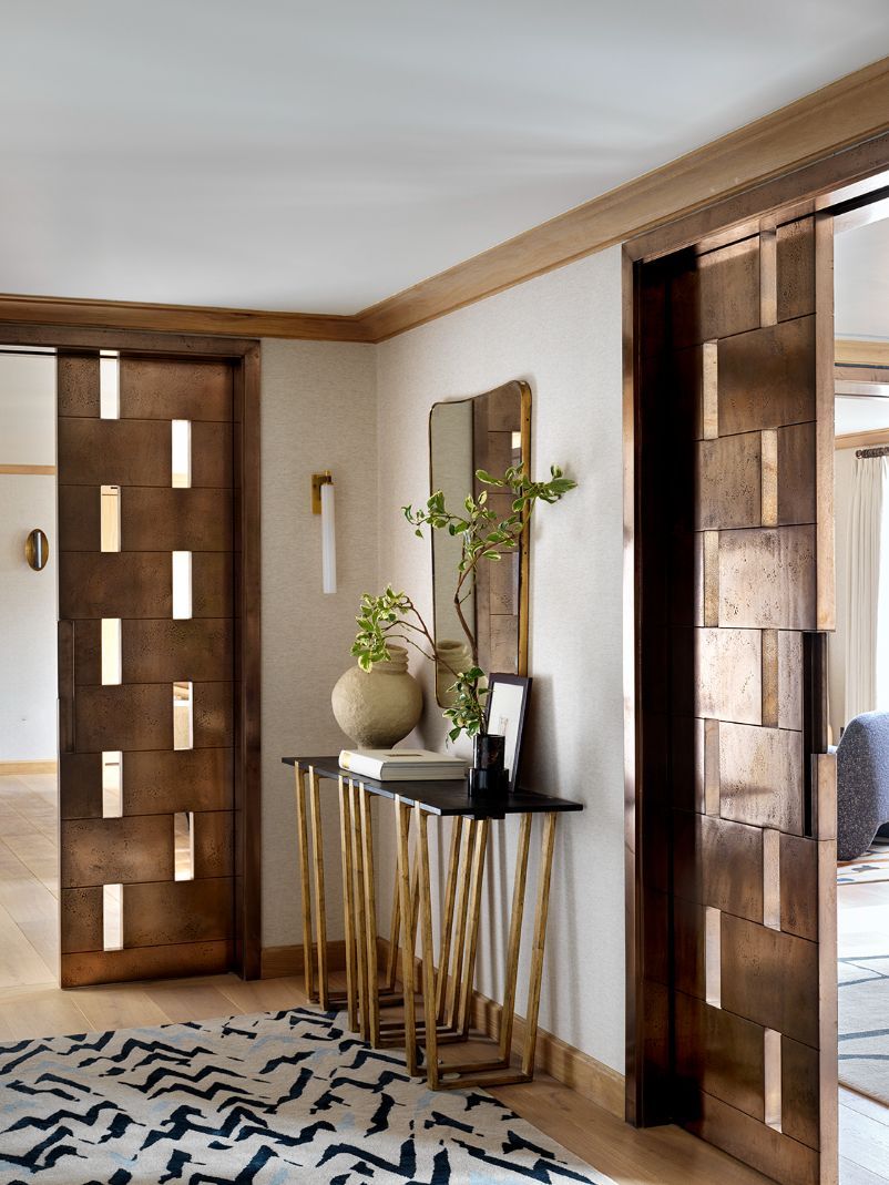 Bespoke antique bronze liquid metal doors set the design tone (Photo: Simon Brown)