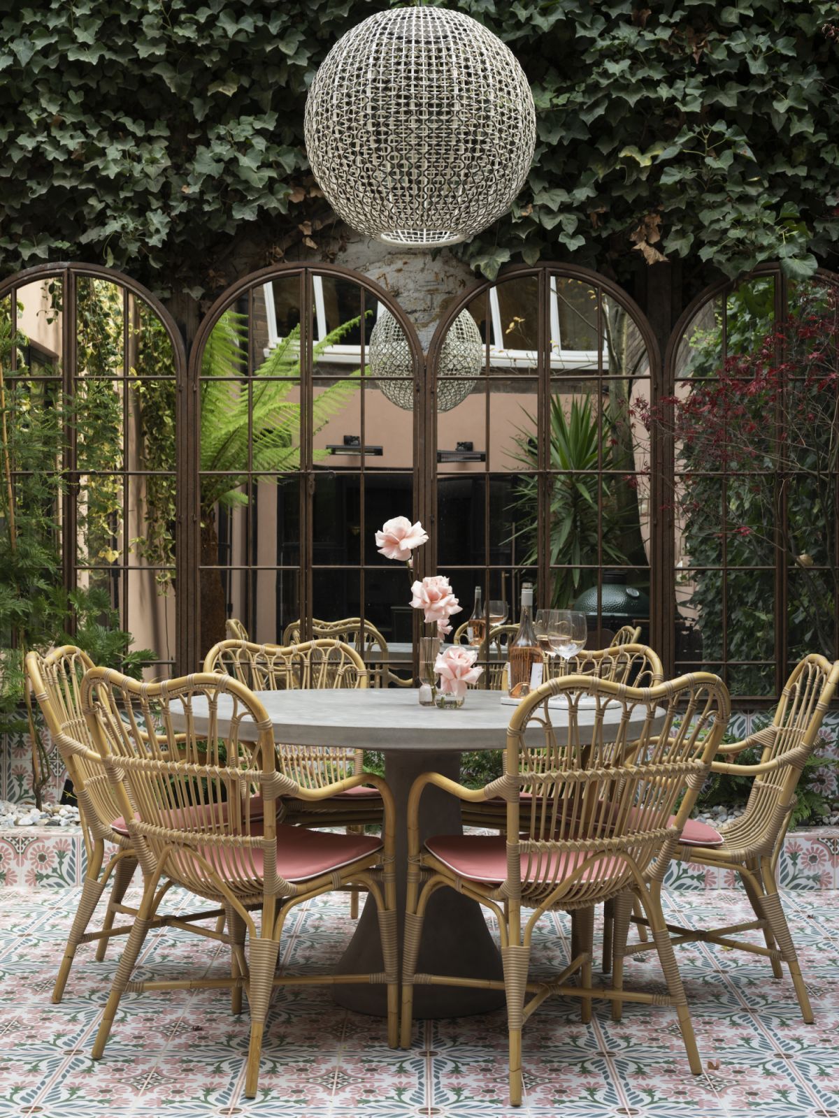 Rattan chairs with arched French door-shaped mirrors (Photo: Richard Gooding)