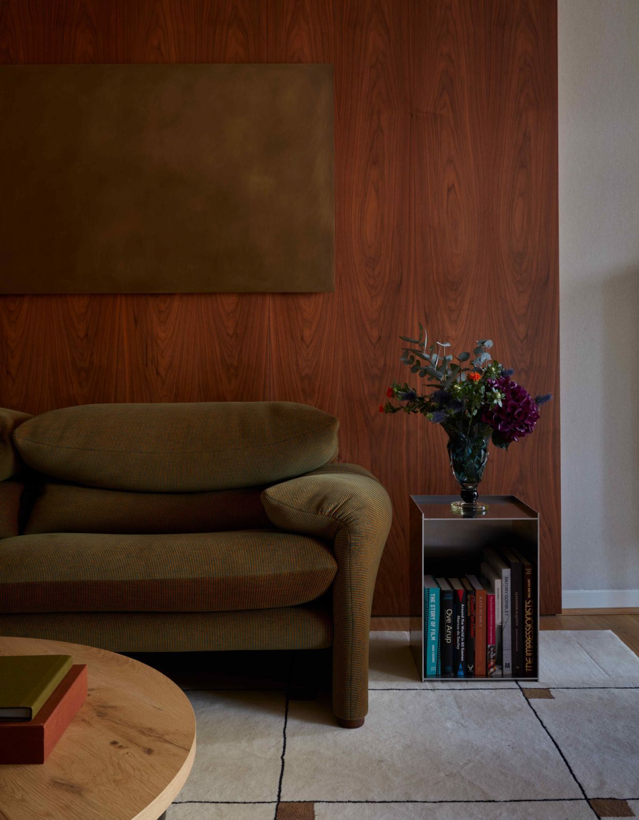 The wall panelling and upholstered sections hide the wiring for the wall lights (Photo: Black & Milk)