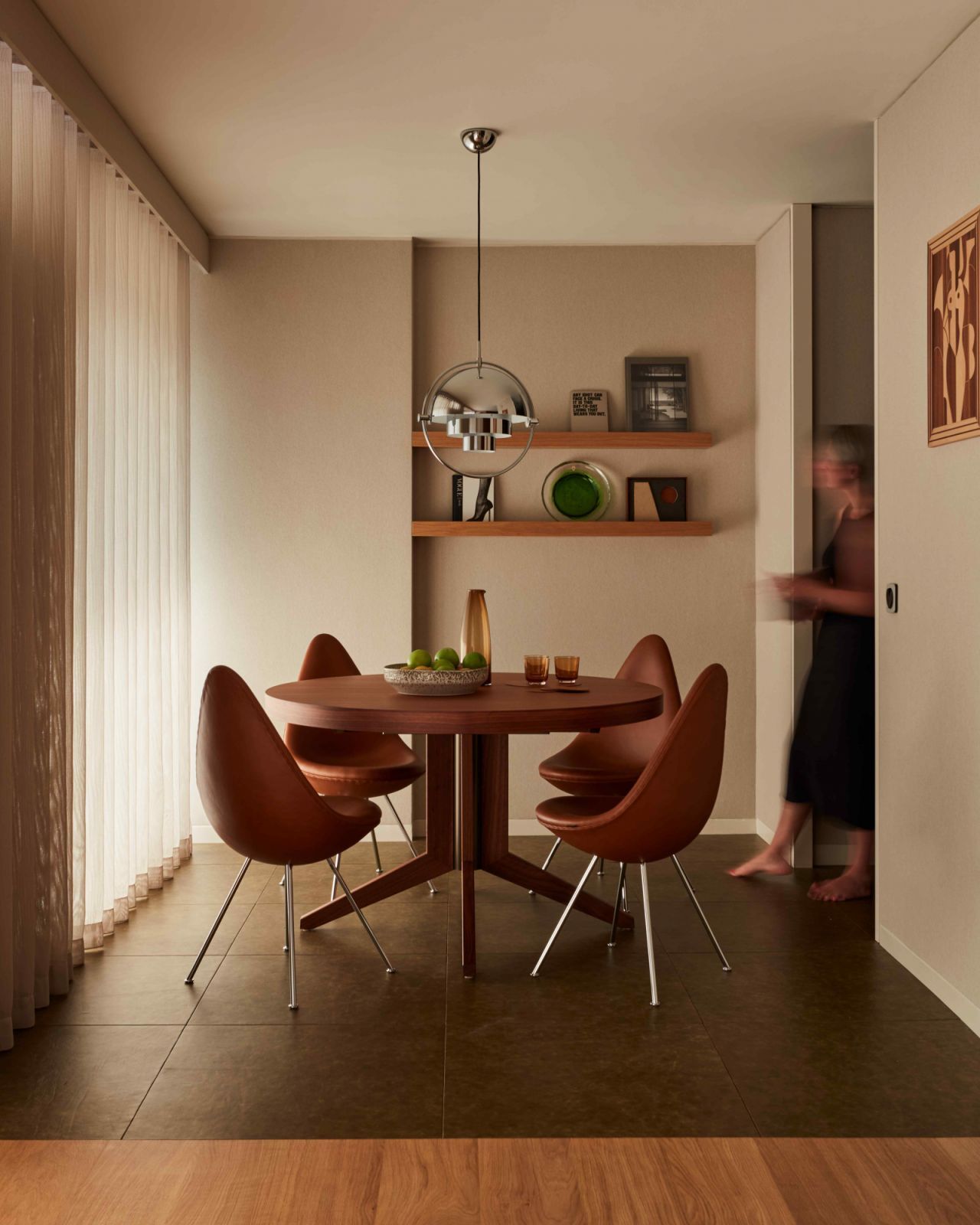 The intimate dining area with mid-century inspired furnishings (Photo: Black & Milk)
