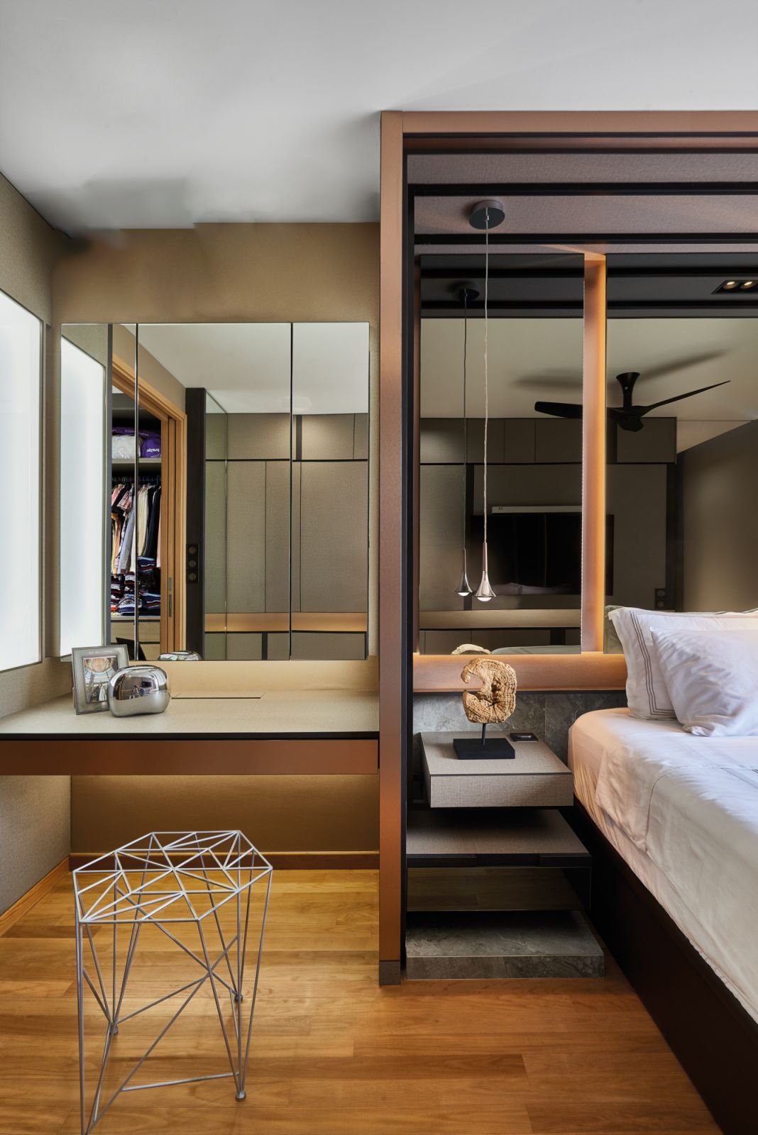 The use of both pale and dark wood creates a harmonious, layered effect in this bedroom