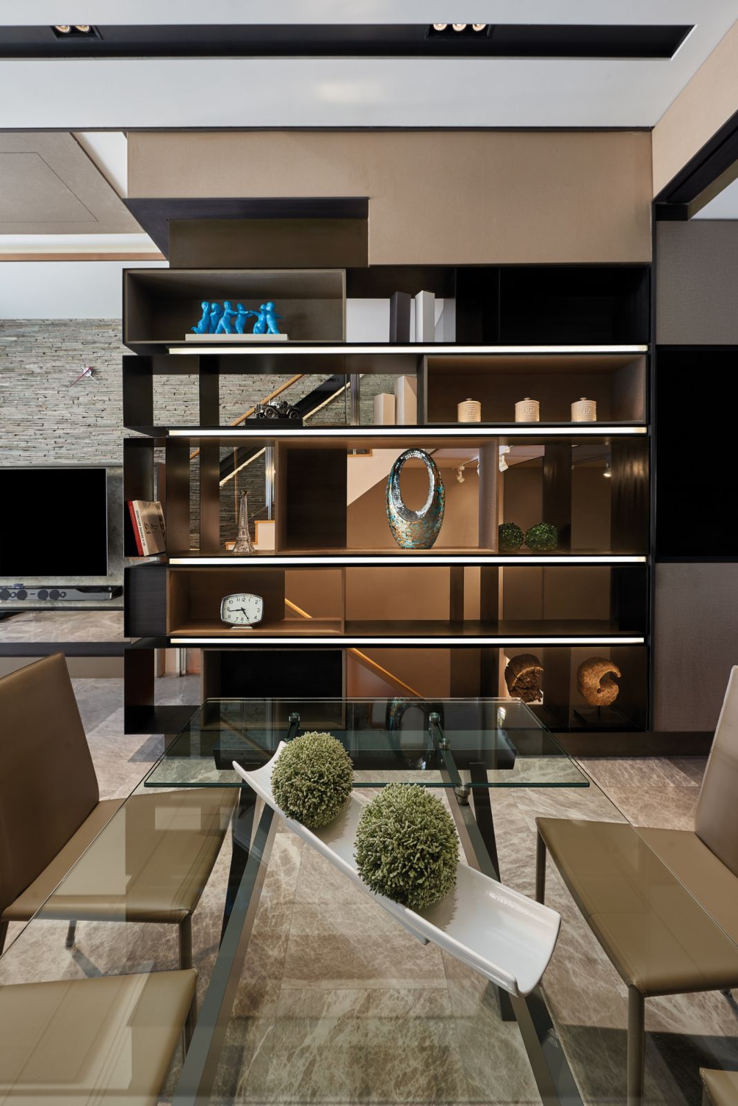 This open shelving unit offers an intriguing peek at the fixtures beyond it
