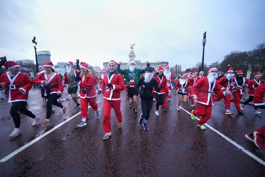 People take part in the Scrambled Legs Running Club 10k Santa Run in central London. Picture date: Saturday December 7, 2024. (Photo by Yui Mok/PA Images via Getty Images)