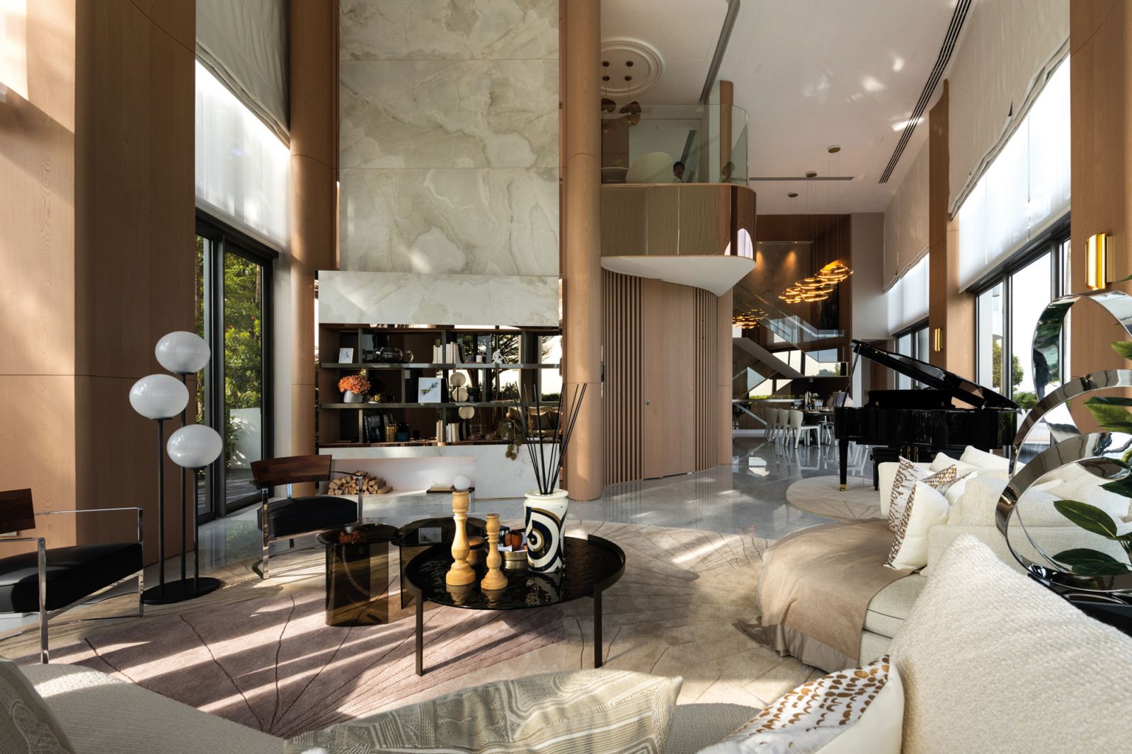 The cleverly angled wall and curved foyer wall mediate the living-dining room connection in the home