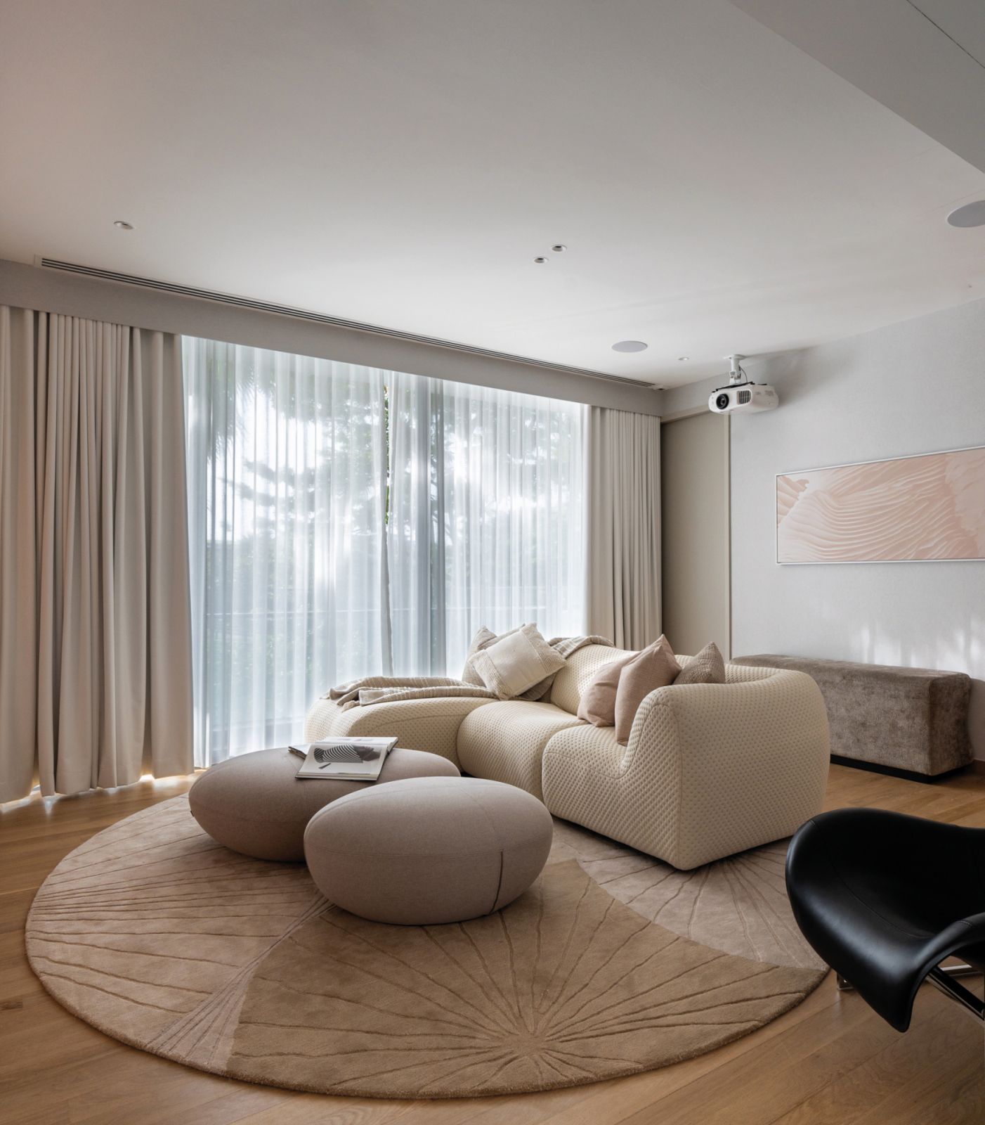 High-tech smart gadgets meet plush furniture in the home theatre