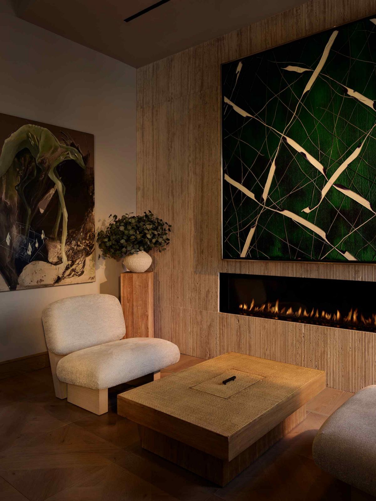 A discreet fireplace integrated into the stone wall