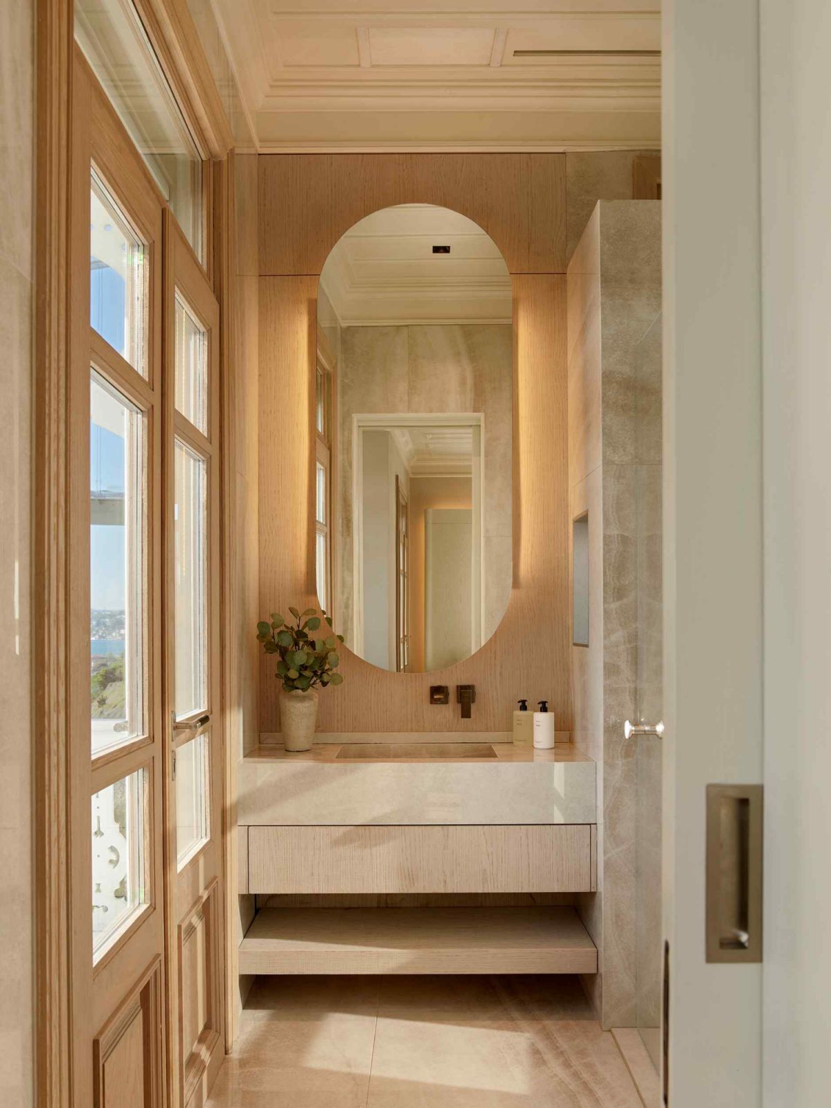 Pale tundra marble permeates the master ensuite