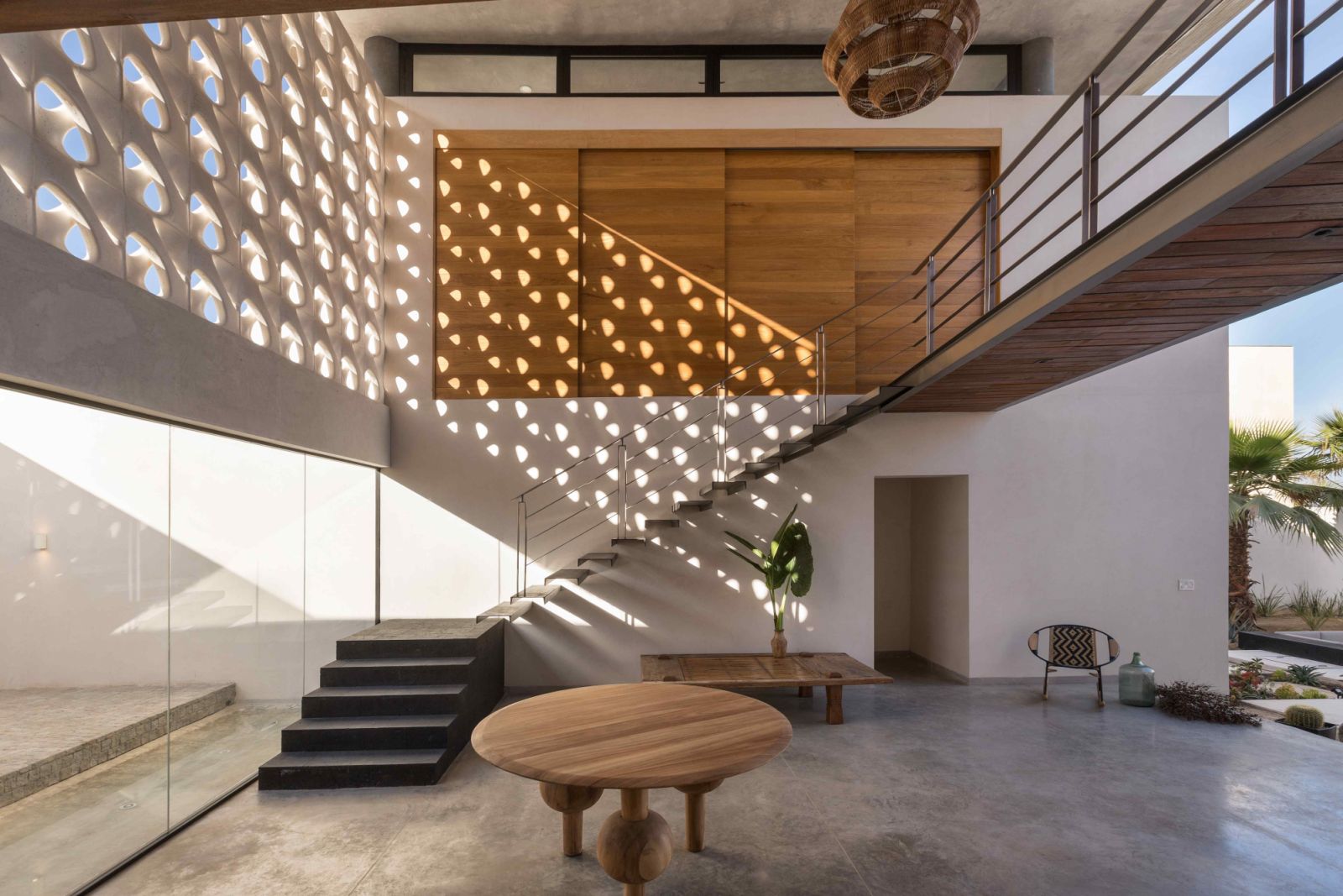 The lattice wall façade facilitates natural light and ventilation into the main entrance foyer