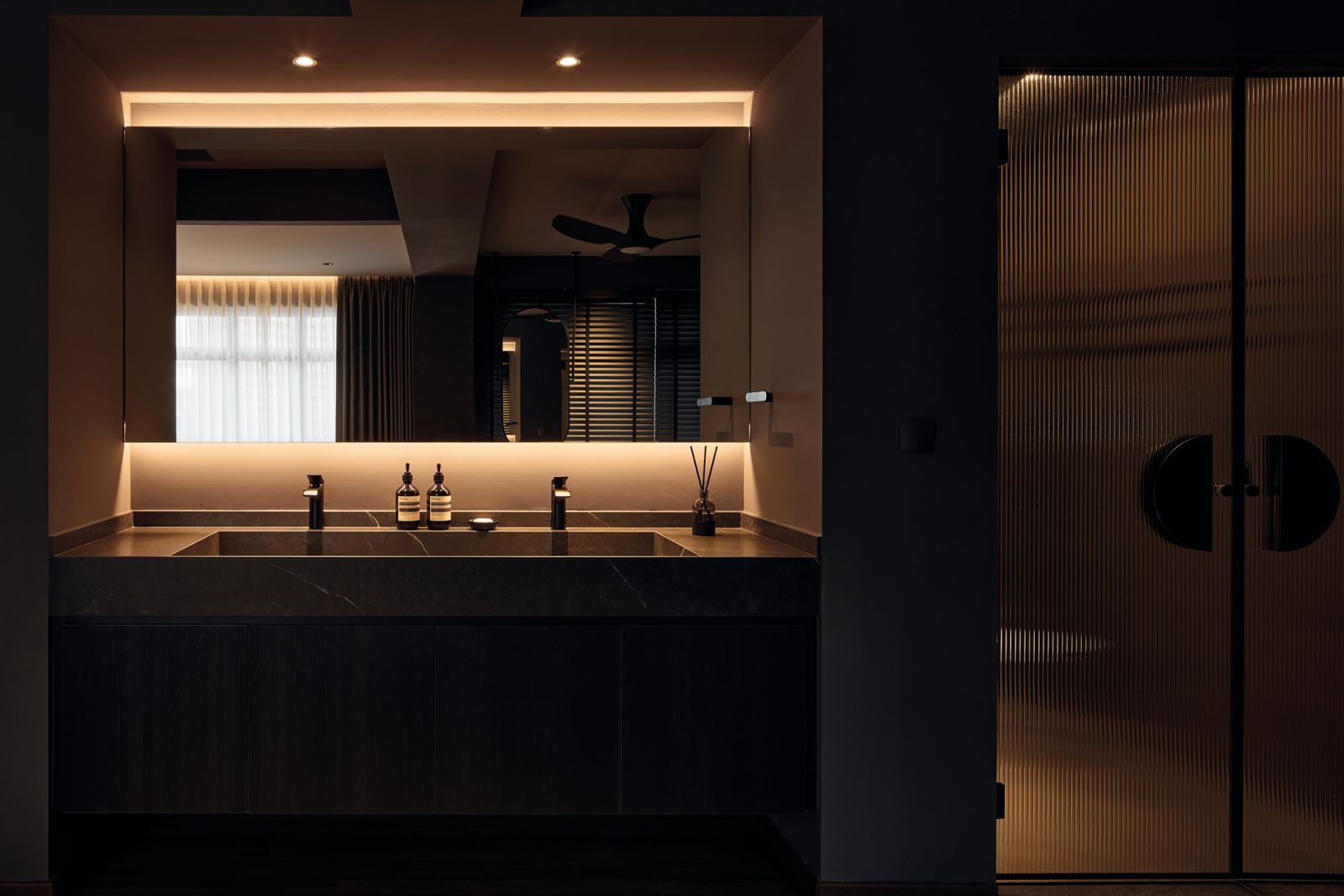 The vanity was relocated to make room for a more spacious water closet and shower area, resulting in a luxurious extension of the bathroom