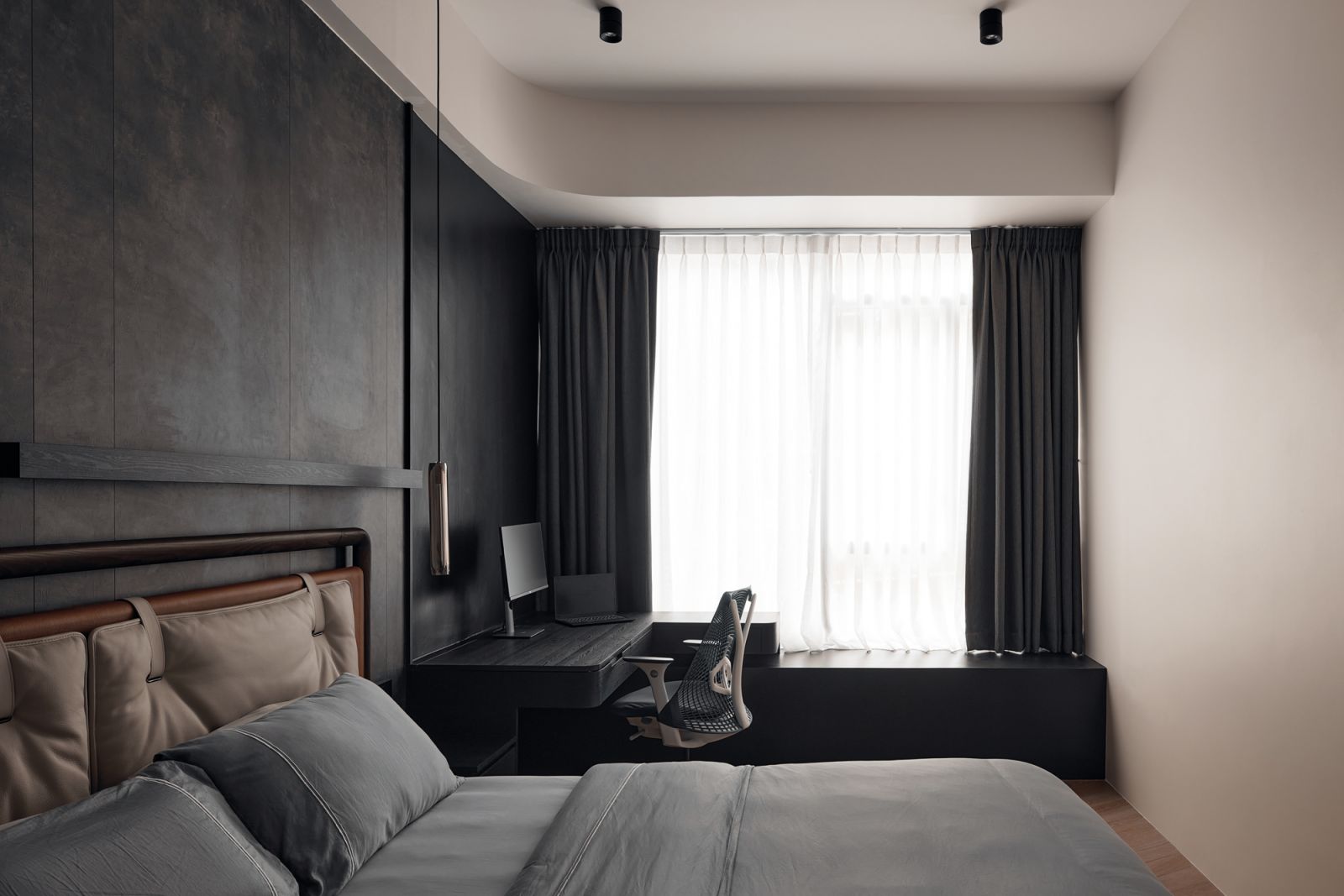 An elegant study finished in dark-stained wood surfaces completes the master suite