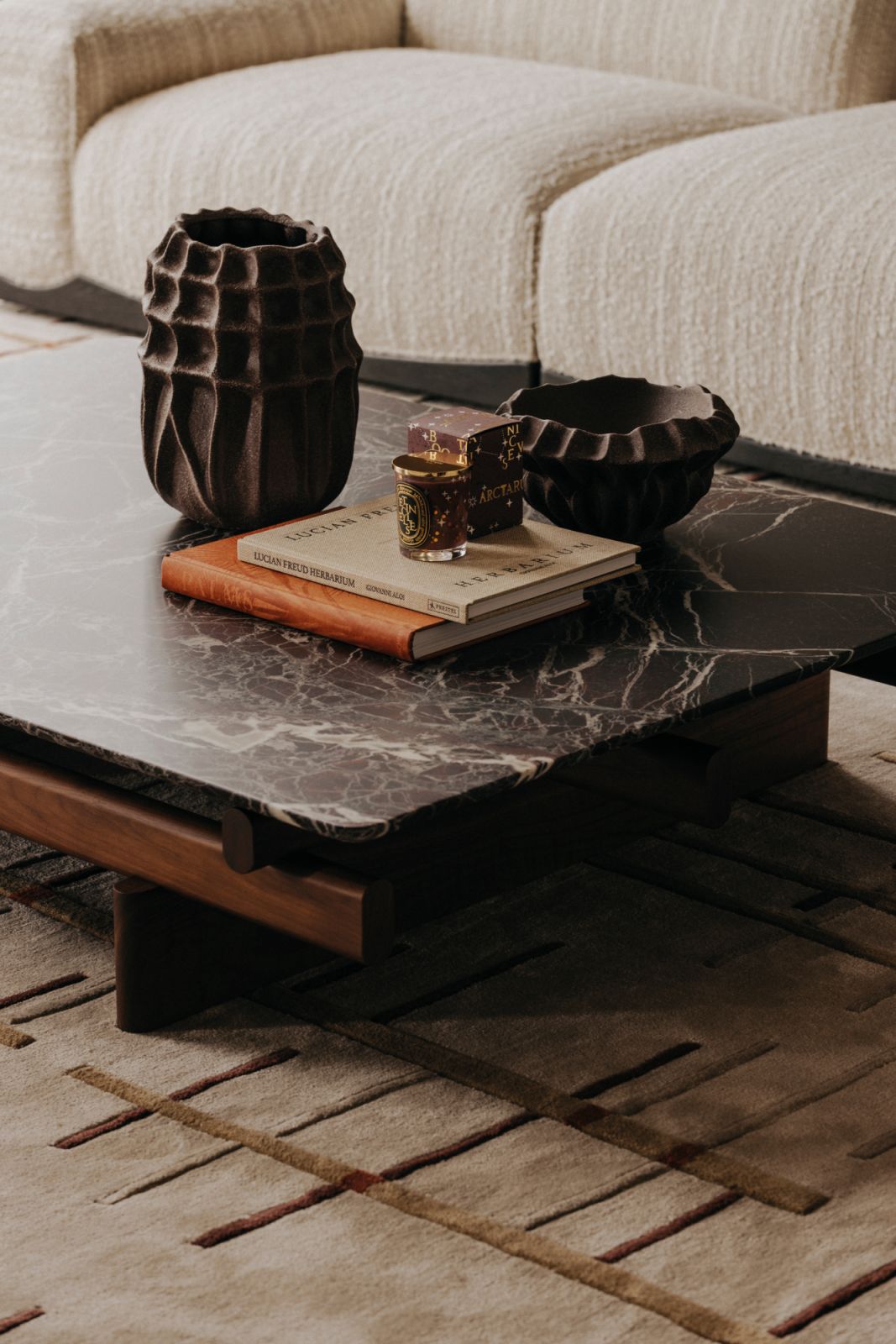 Furnishings of varying textures are carefully selected and assembled to create an artistic tableau in the living room