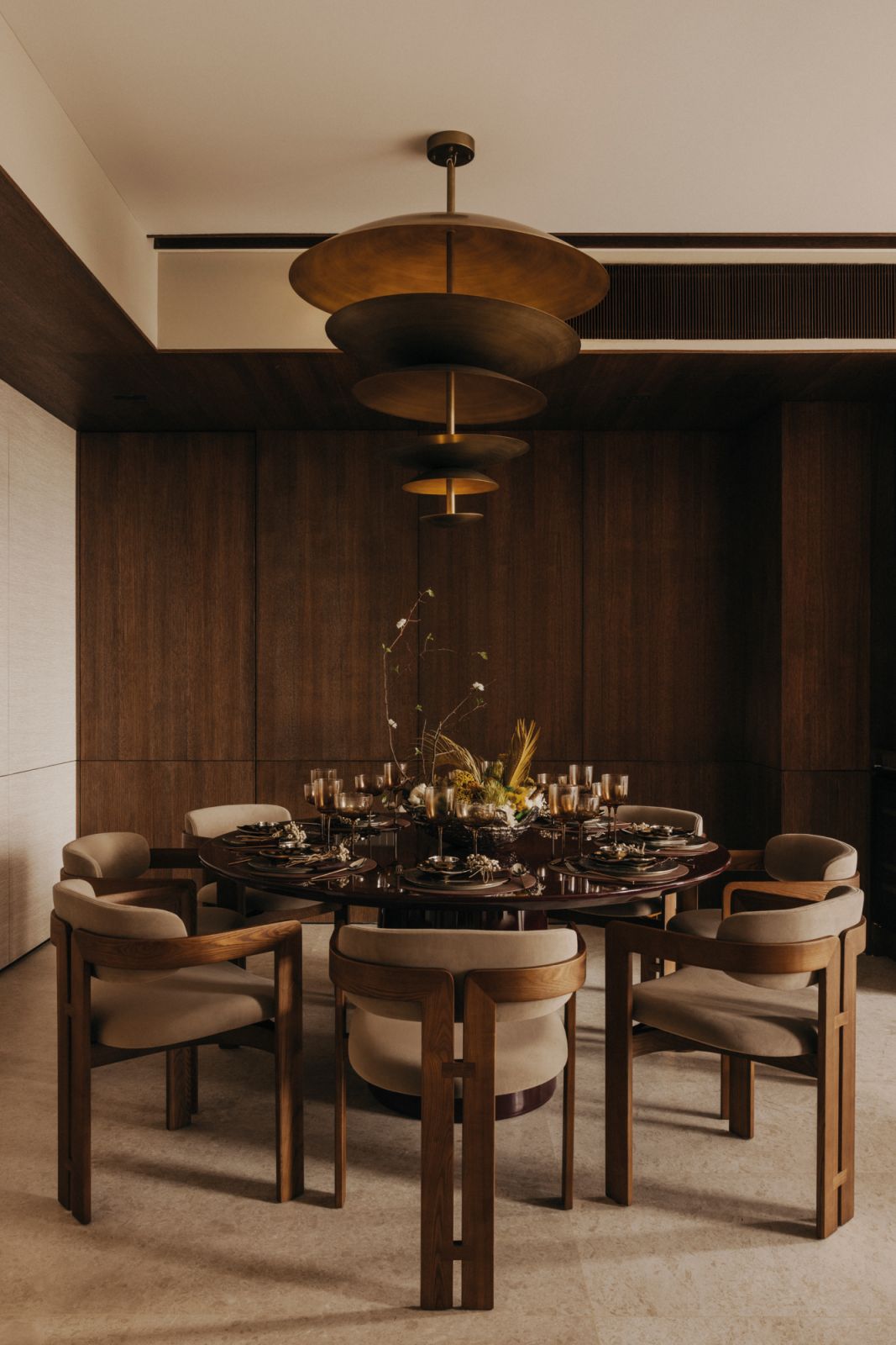 Dressed in wood tones, the dining room is an elegant take on modern Asian sensibilities