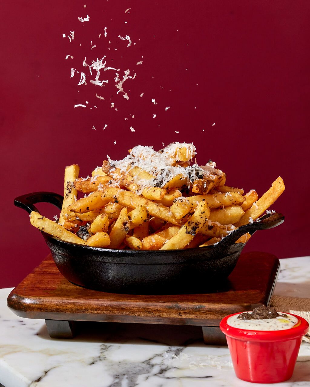 Truffle Fries: crispy truffle fries topped with parmesan snow